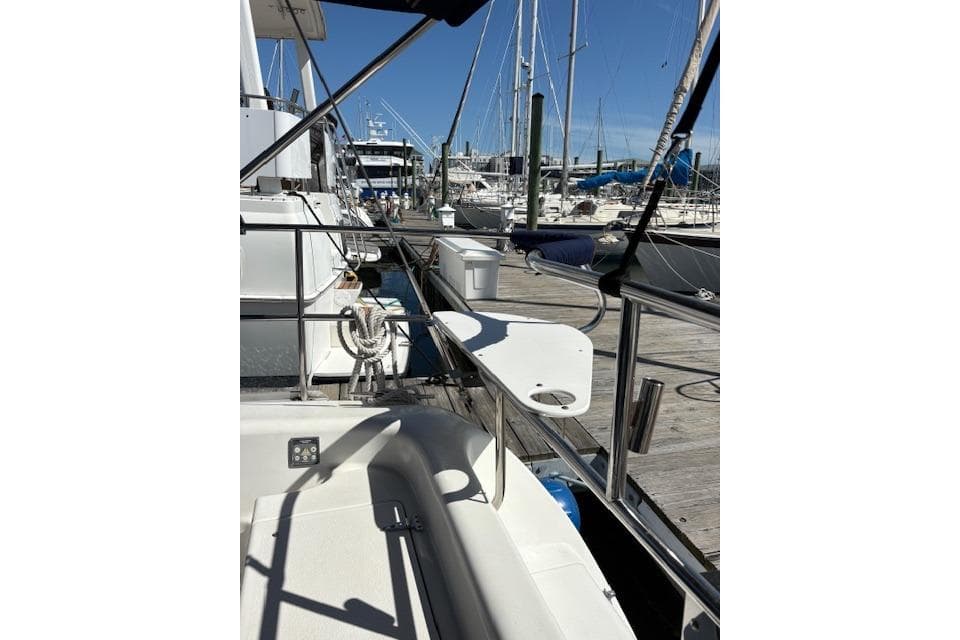 Catalina 400 MkII 2002 sailboat docked at marina with clear blue sky.