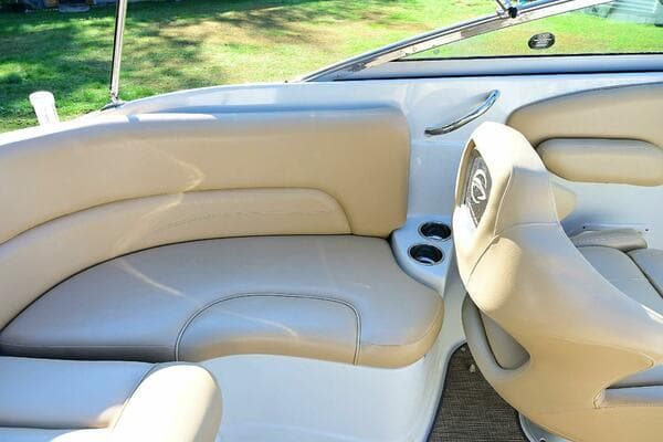 2015 Crownline 236 SC boat interior with beige seating and cup holders.