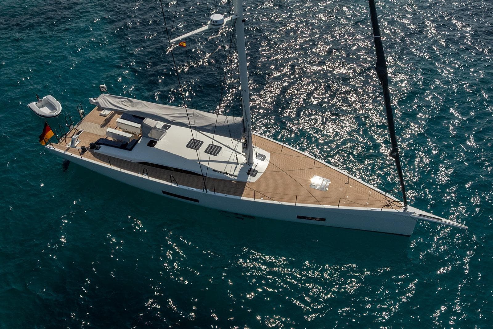 Aerial view of 2024 Knierim Yachtbau Surge 62 sailing on clear blue water.