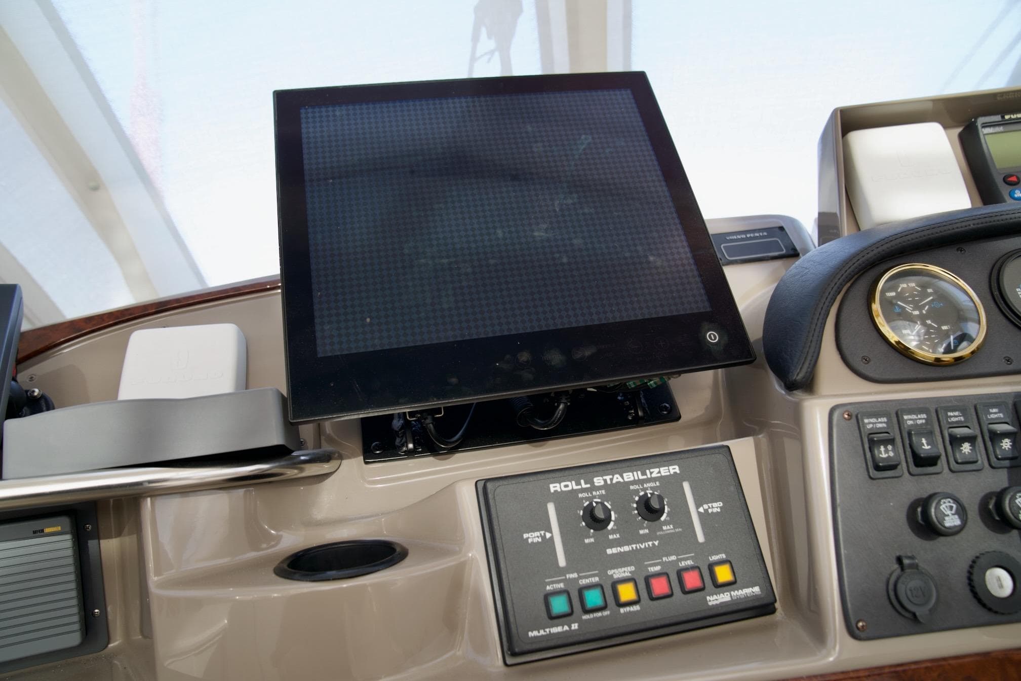Control panel of a 2000 Carver 506 Motor Yacht with navigation and stabilizer systems.