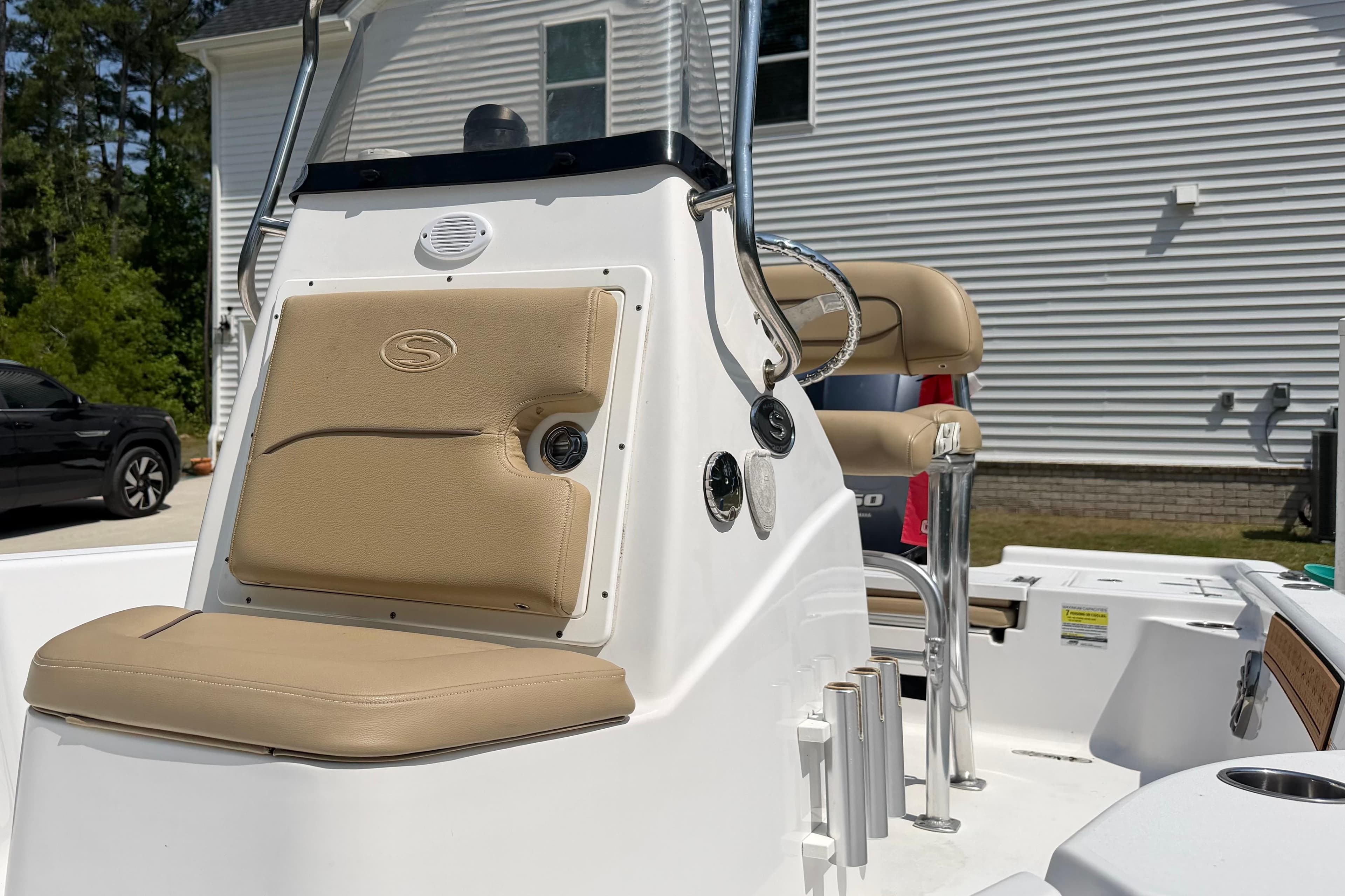 2017 Sportsman Masters 207 Bay Boat interior with beige seating and console.