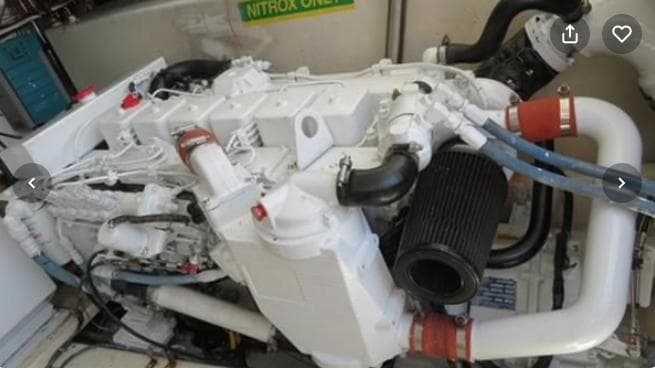 Engine of a 2001 Topaz Express boat, featuring white and black components.