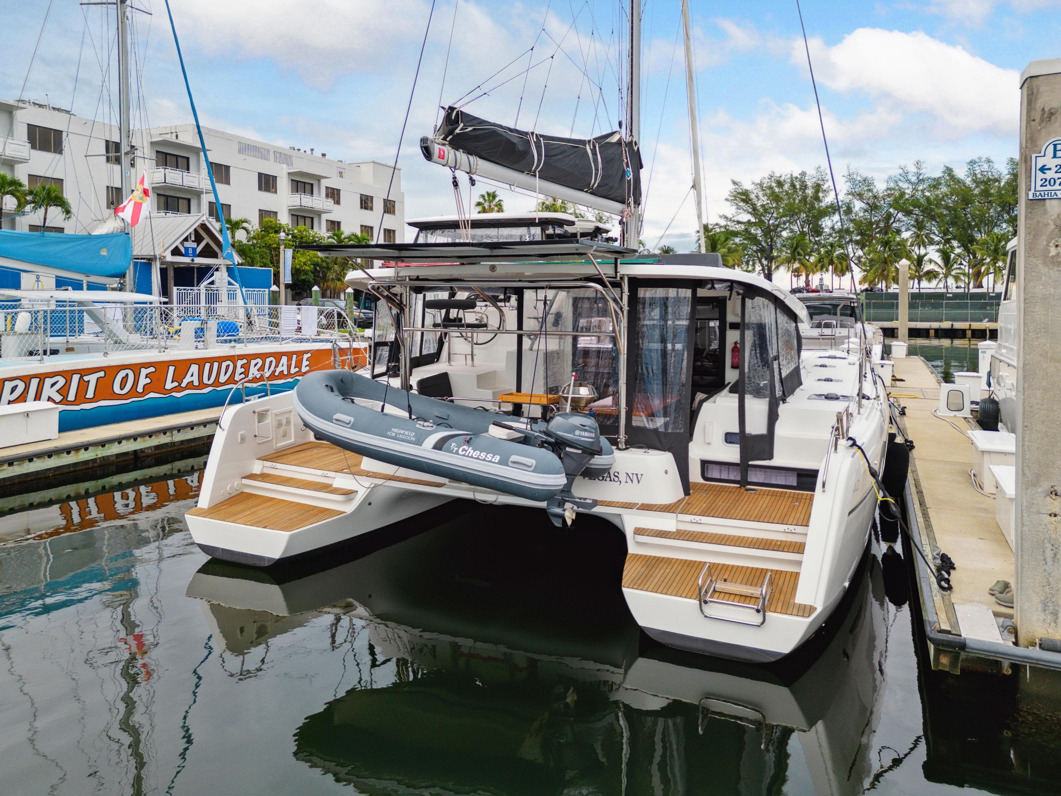 2019 Lagoon 42 catamaran docked with dinghy.
