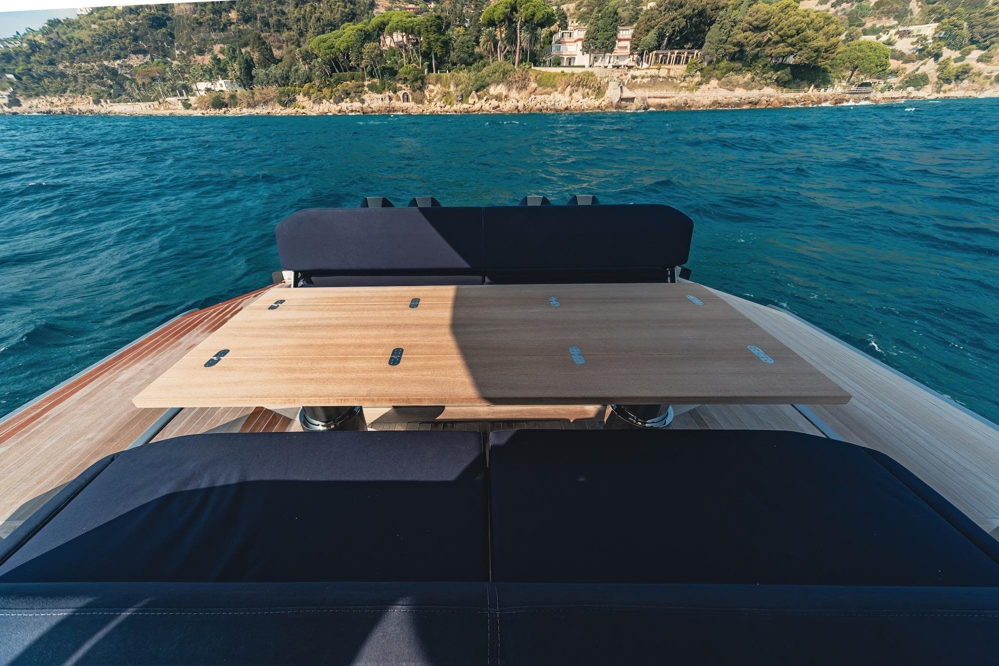 Luxurious 2023 Wally Tender 48X yacht with elegant deck seating and scenic ocean view.