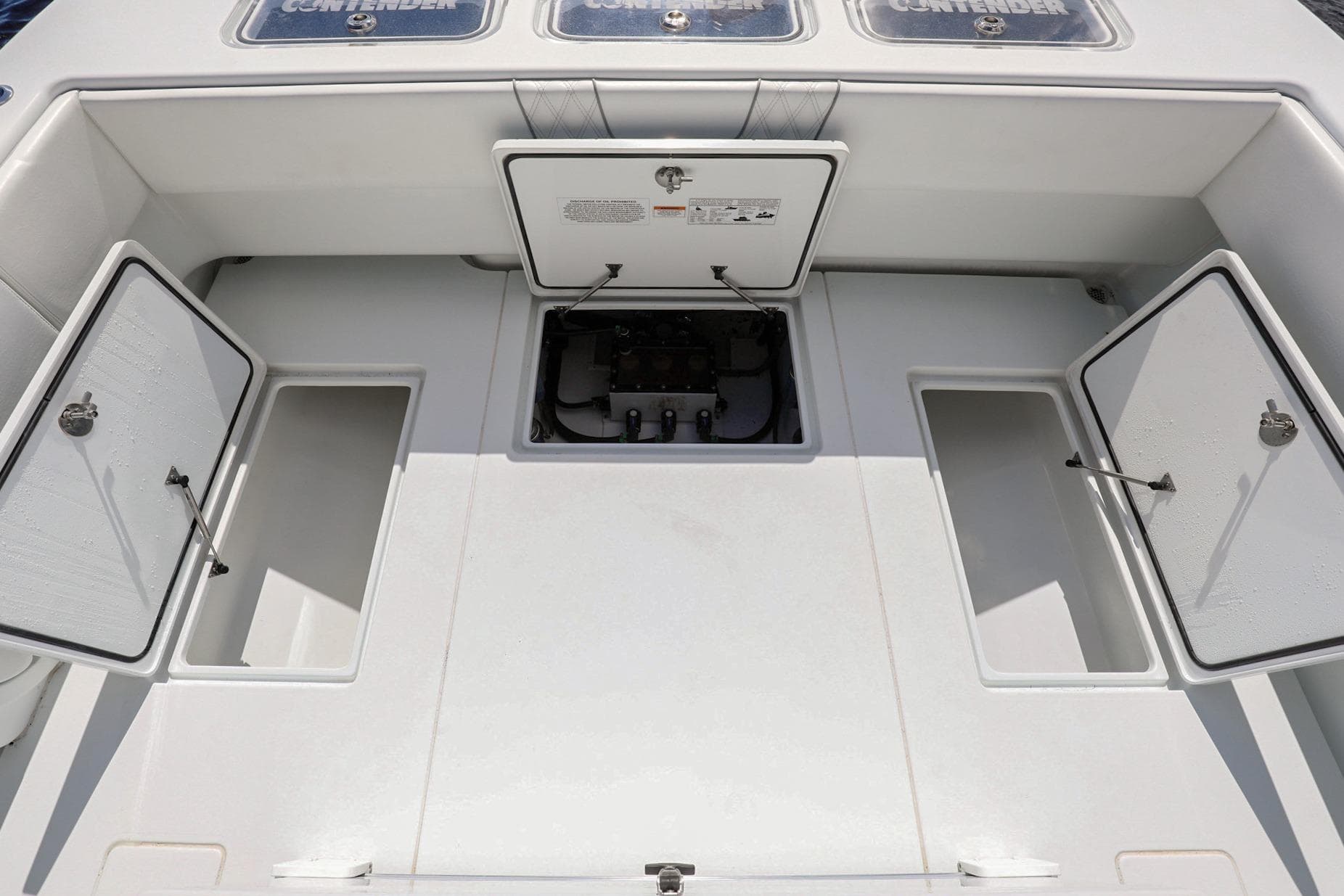 2023 Contender 44 ST boat deck with open storage compartments.