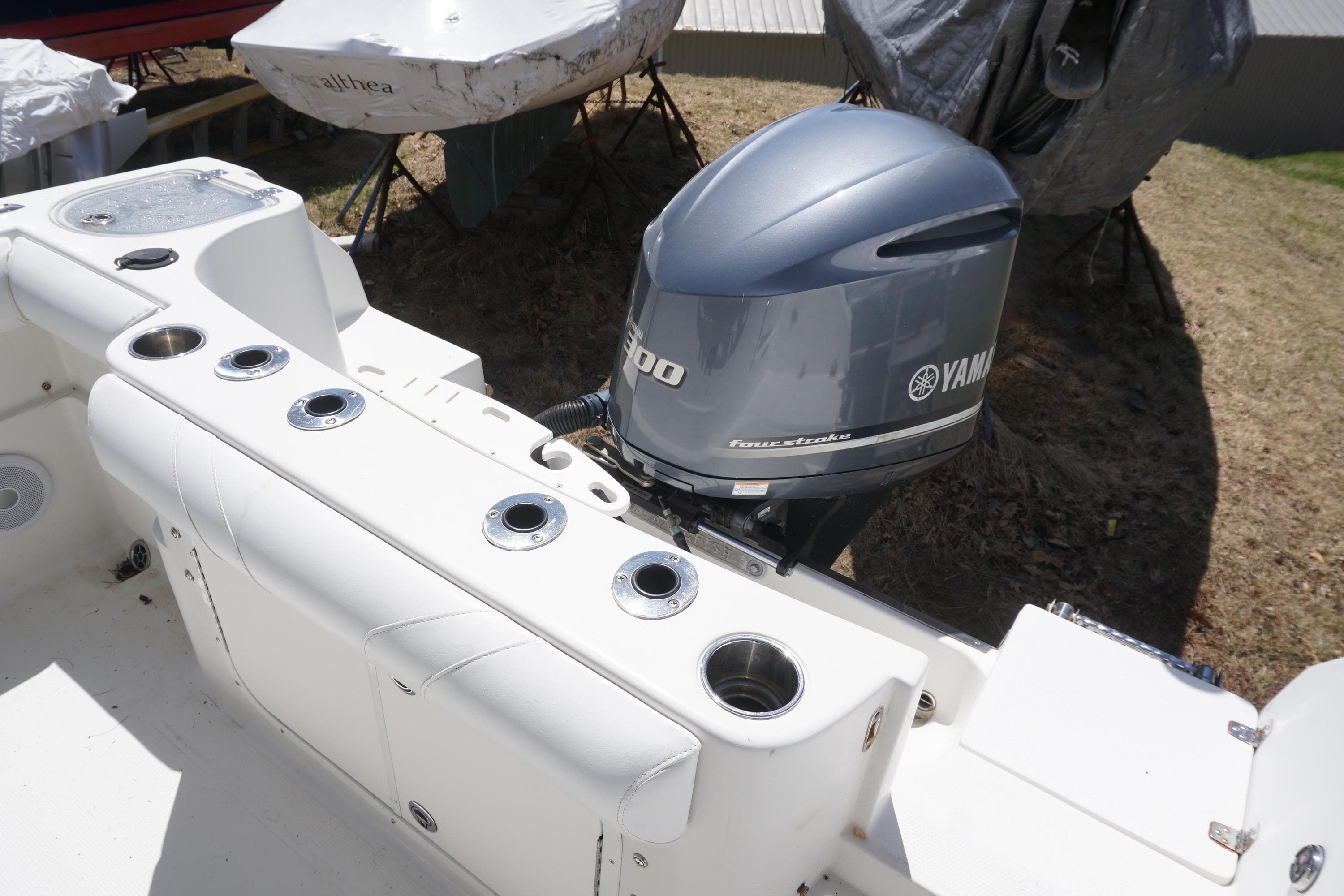 2012 Sailfish 2380 CC boat with Yamaha outboard motor, featuring rod holders and seating.