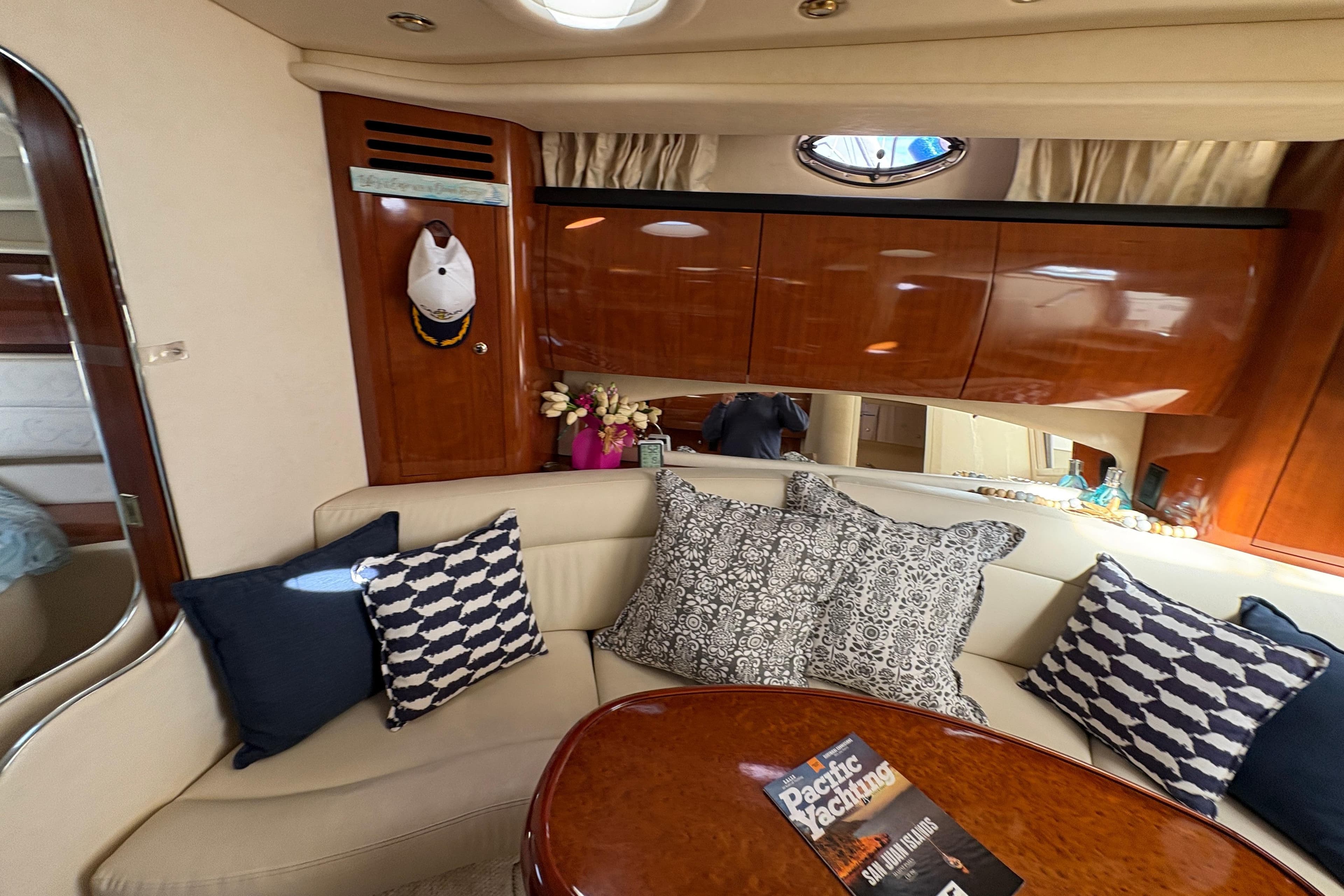 Luxurious interior of 2003 Sea Ray 360 Sundancer with plush seating and elegant decor.