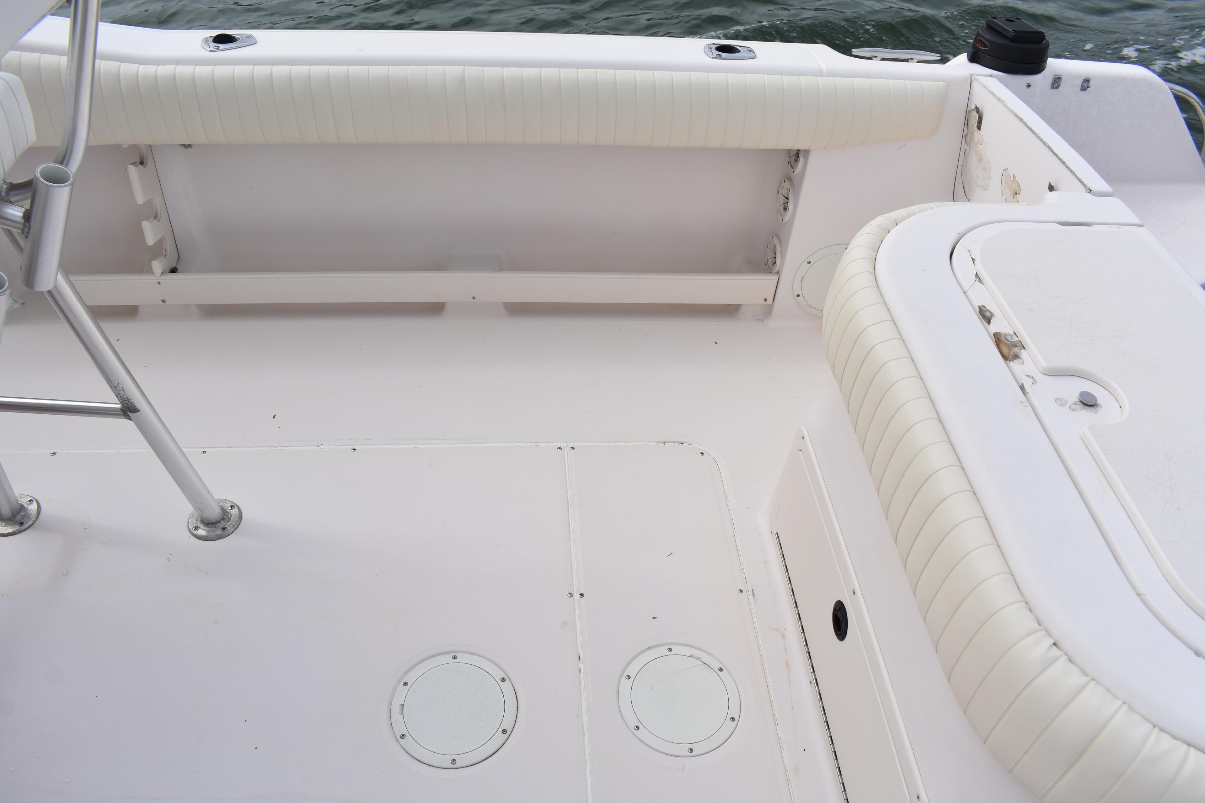 2001 Grady-White Advance 247 boat interior with white seating and deck details.