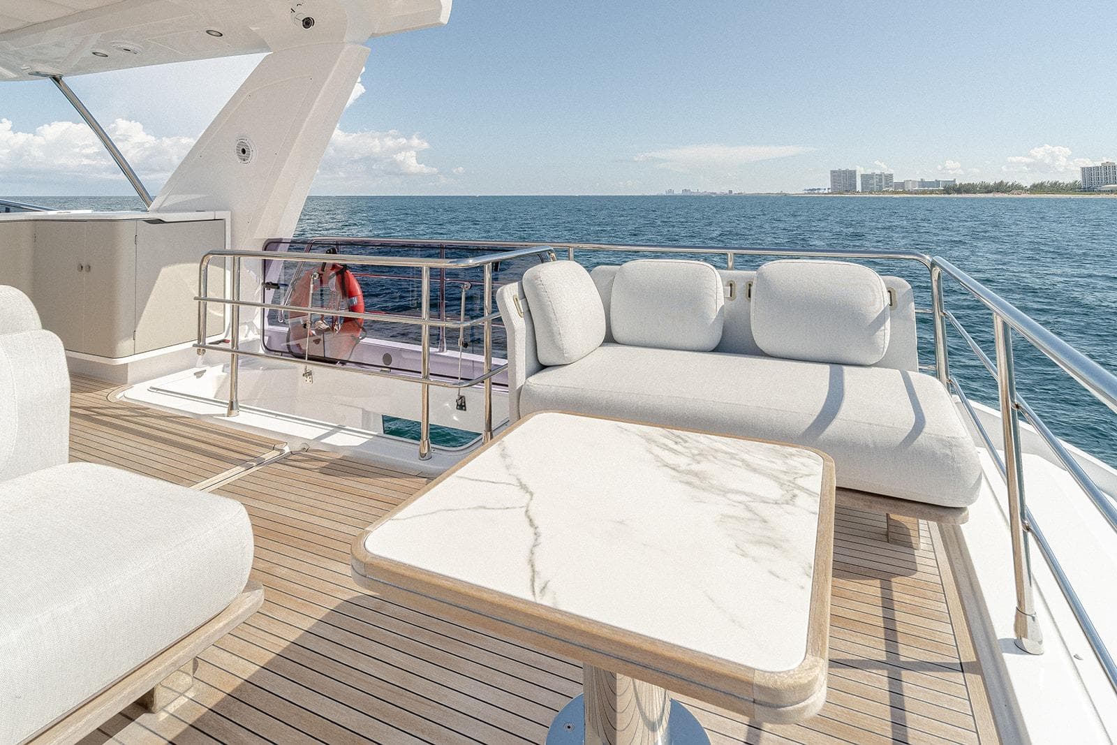 Luxurious 2020 Azimut 60 yacht deck with elegant seating and ocean view.