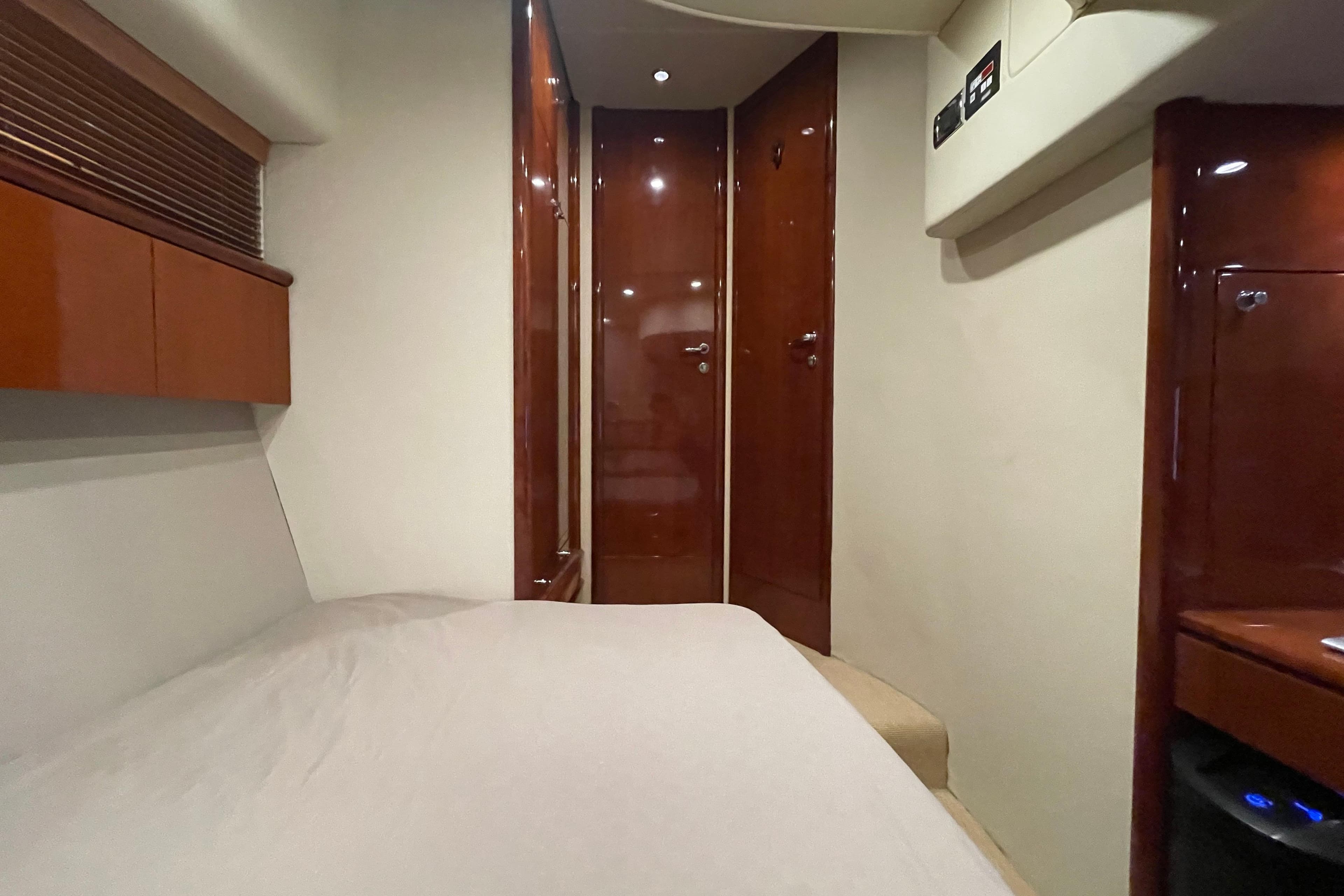 Interior cabin of 2001 Fairline Squadron 58 yacht with wooden finishes.