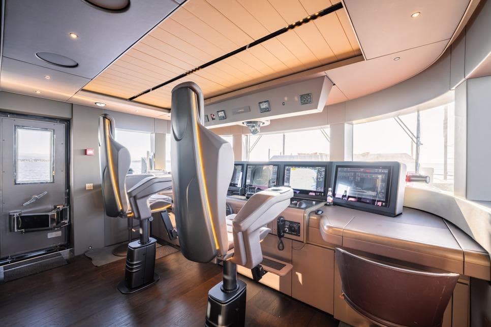 Modern Admiral S-Force 55 yacht cockpit, 2025 model, featuring advanced navigation systems and sleek design.