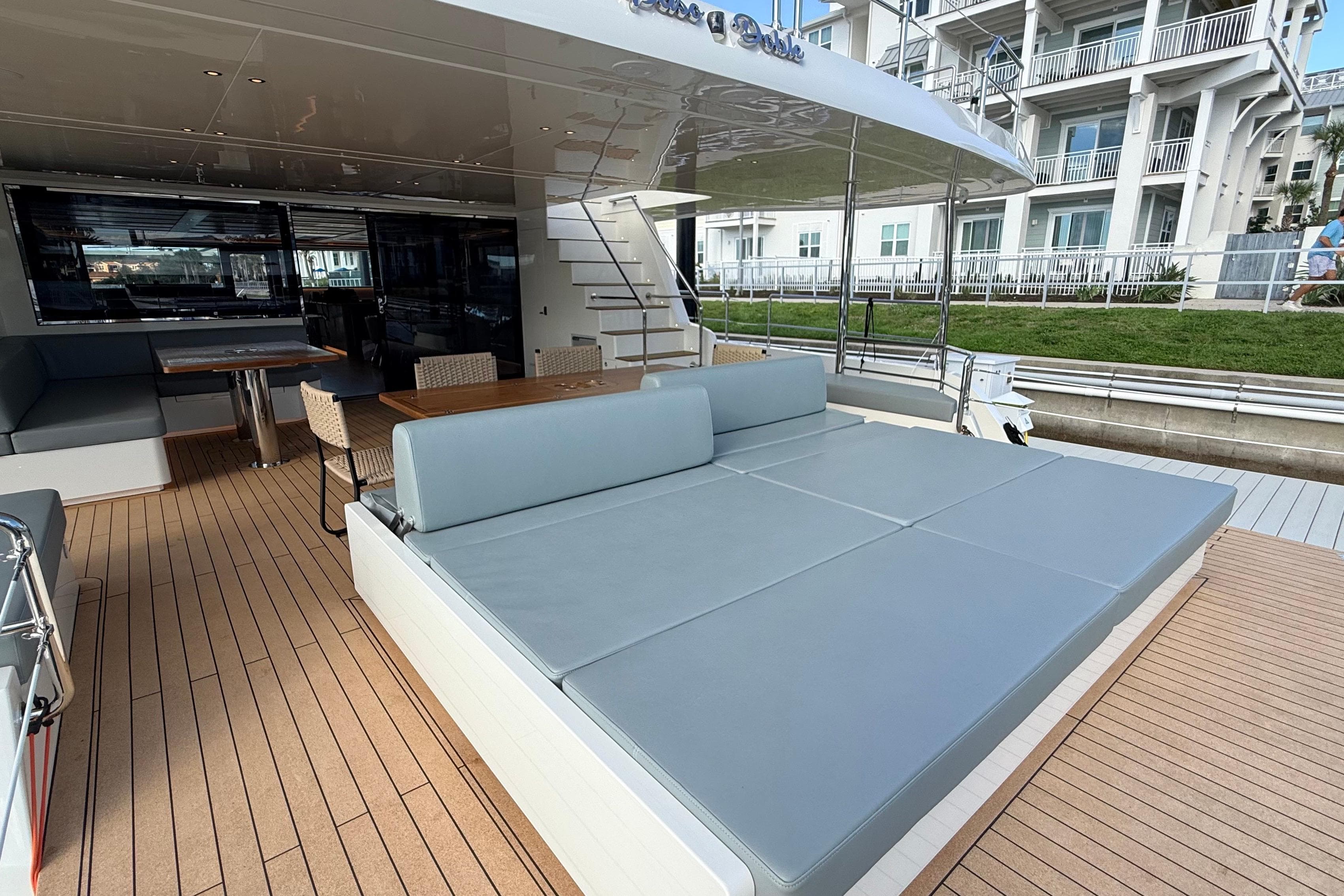 Luxurious Granocean W72 yacht deck with seating and dining area, 2025 model.