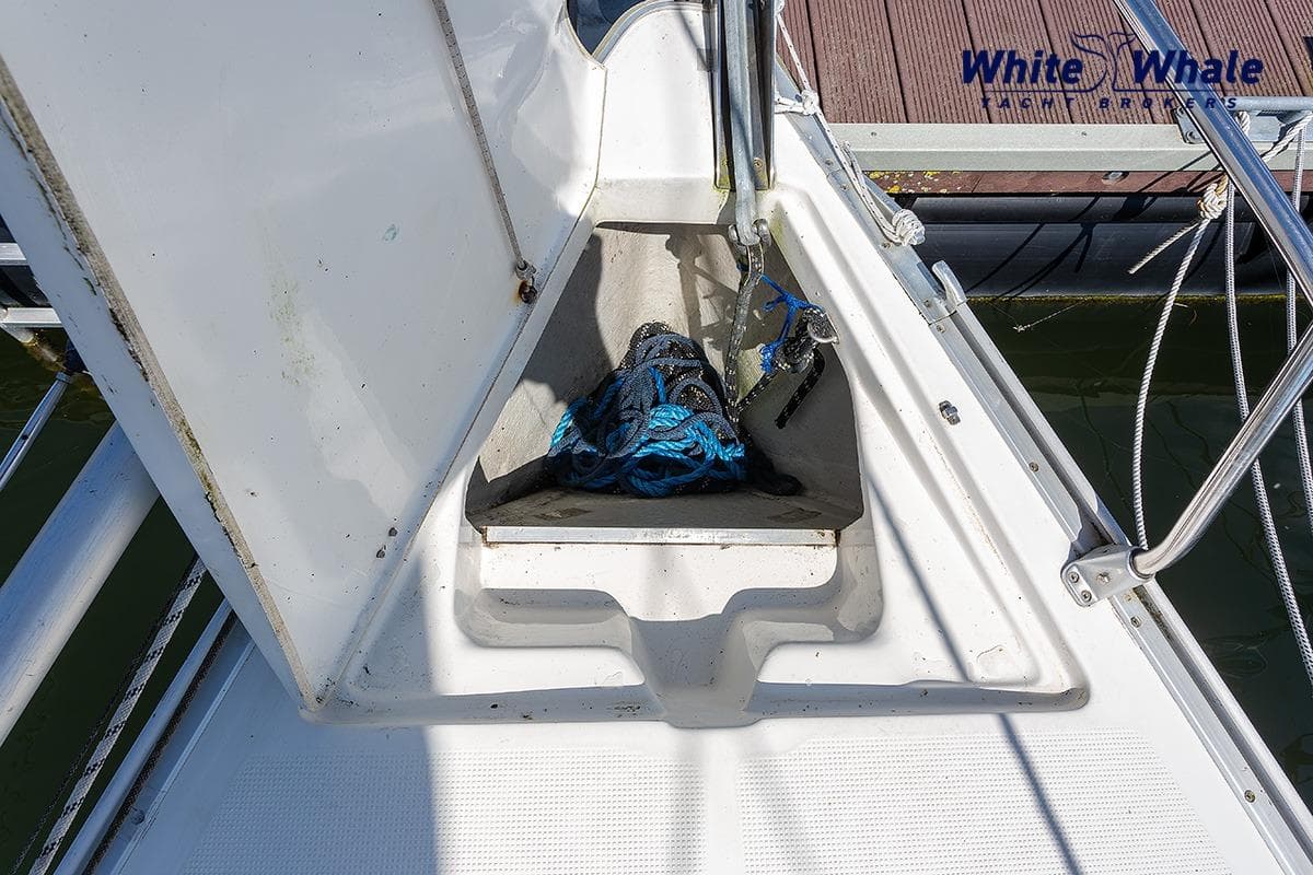 Bow of 2006 Bavaria Cruiser 30 yacht with anchor and ropes.