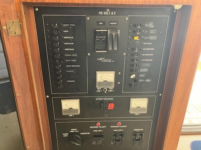 Electrical panel of a 1983 Viking Convertible boat, featuring various switches and meters.