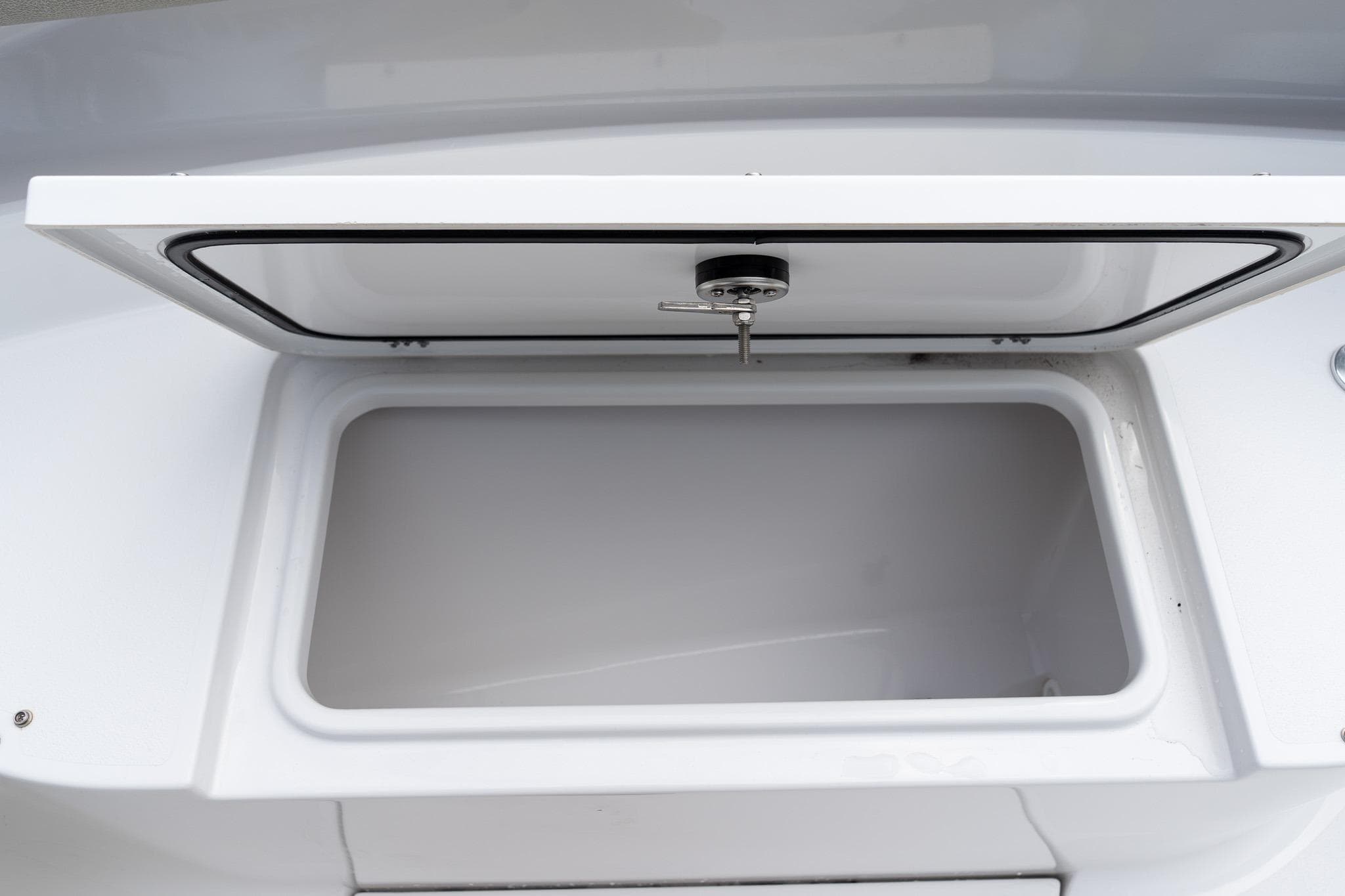 Open storage compartment on 2025 Sportsman Open 322 Center Console boat.