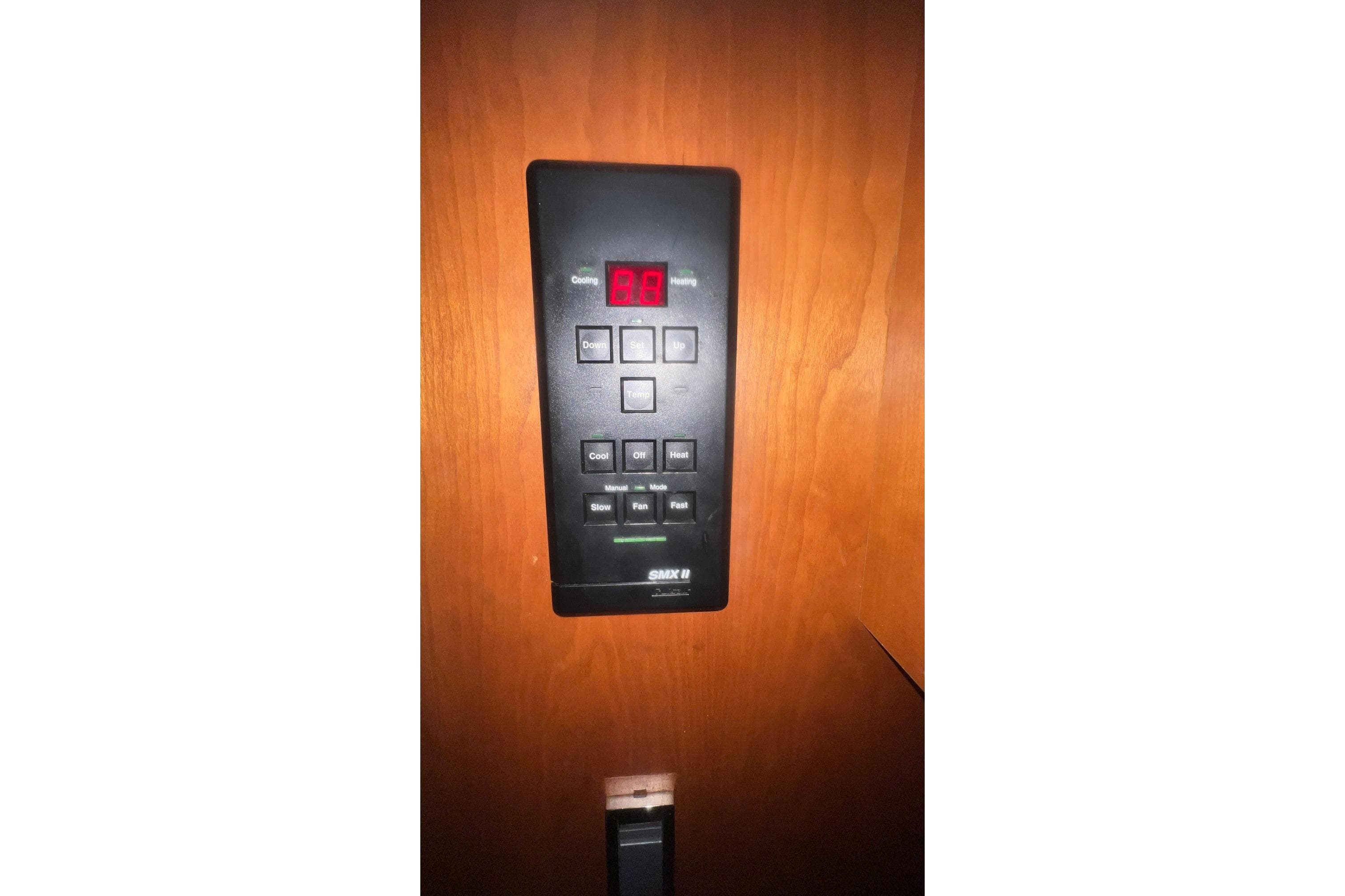 Control panel on 2001 Cruisers Yachts 3572 Express, mounted on wooden surface.