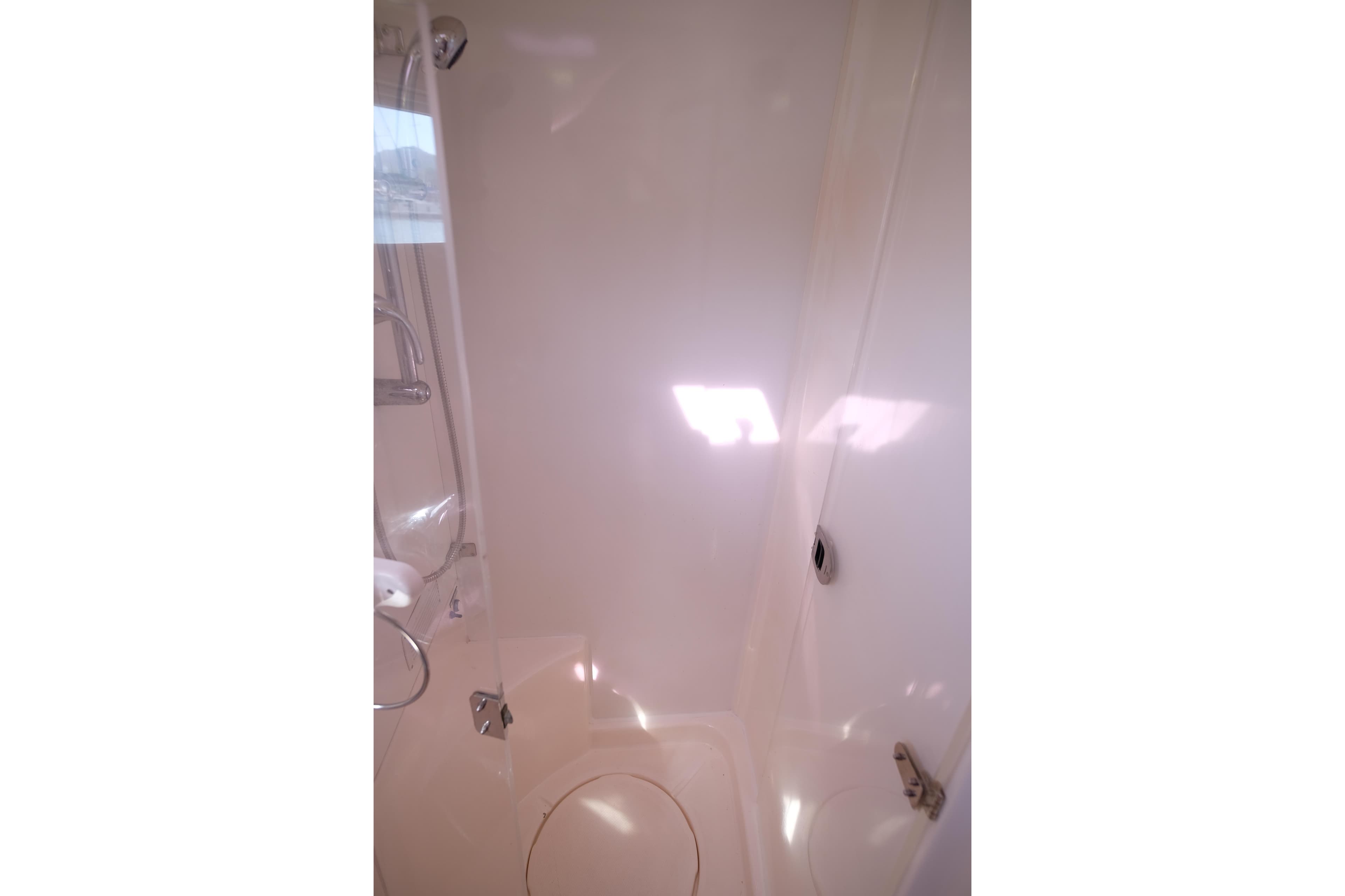 Bathroom interior of 2009 Leopard 46 yacht, featuring a sleek shower design.