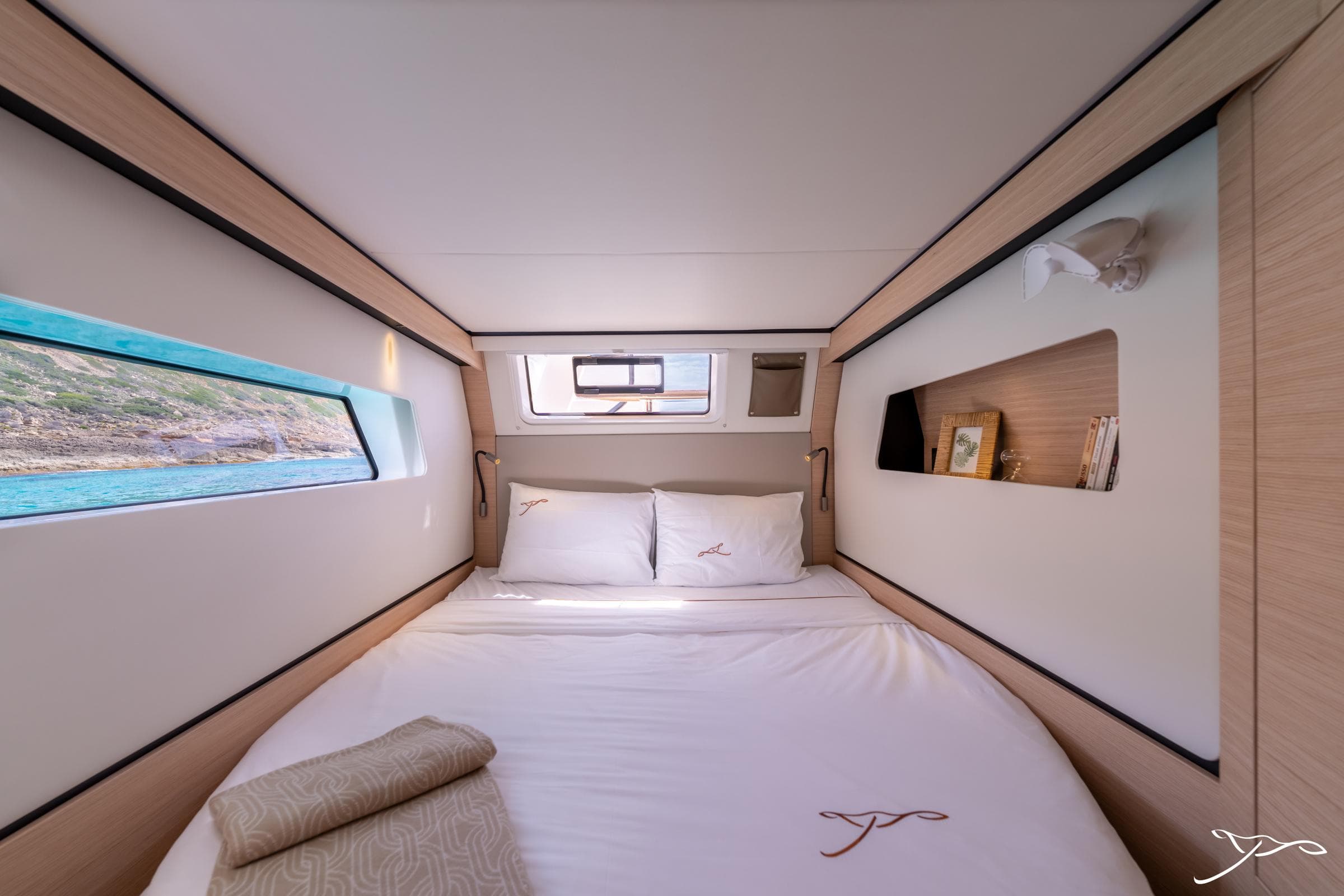 Luxurious cabin interior of 2025 Nautitech 44 Open yacht with scenic window views.