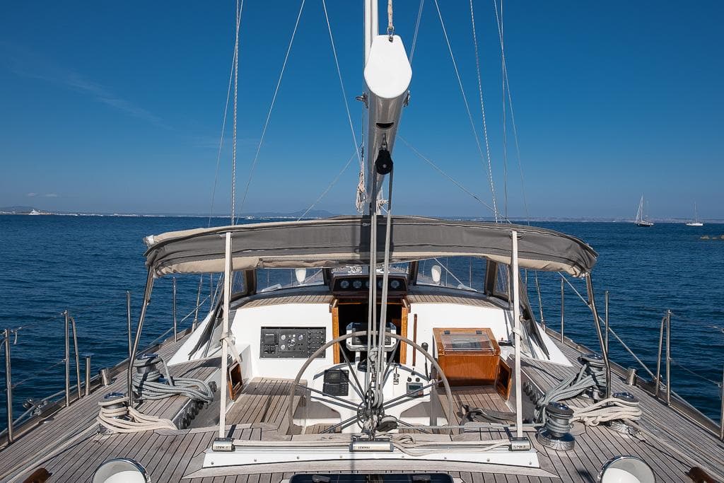 Nordia 58 yacht deck, 2001 model, sailing on calm blue waters under clear skies.