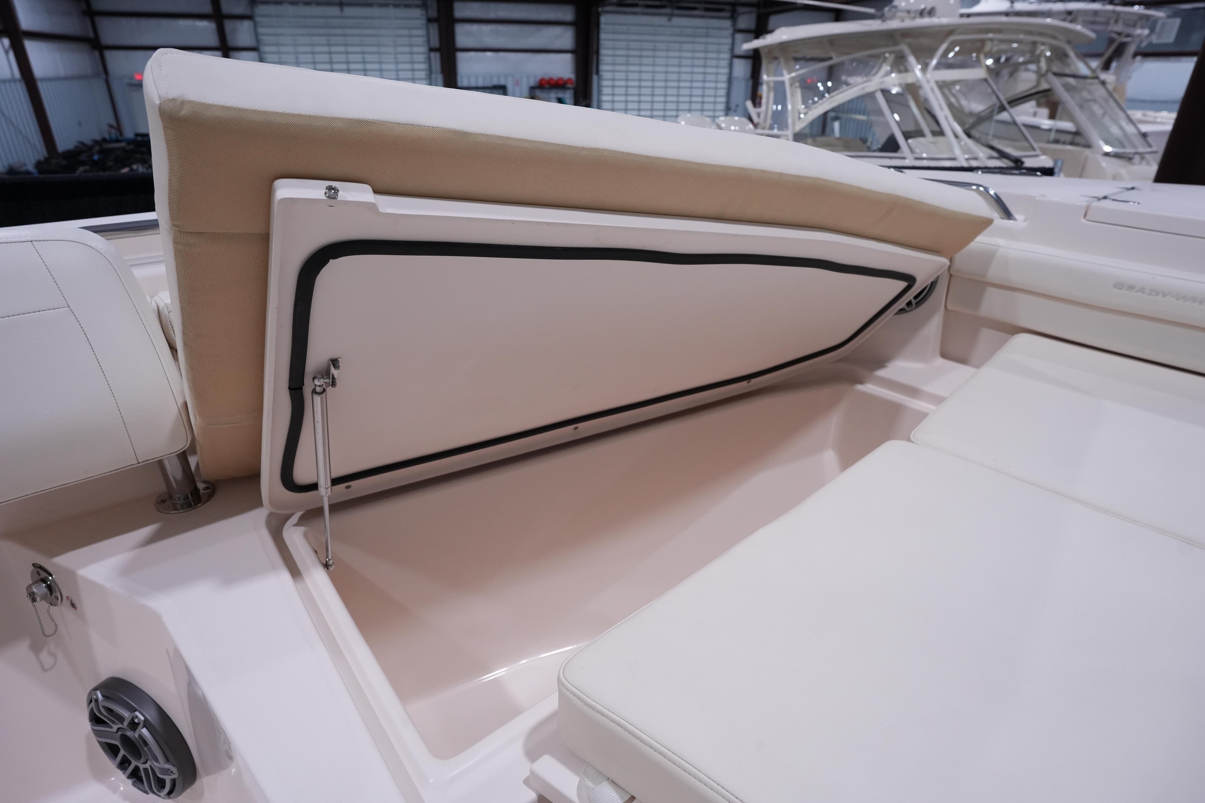 2023 Grady-White Canyon 336 boat interior storage compartment with cushioned seating.