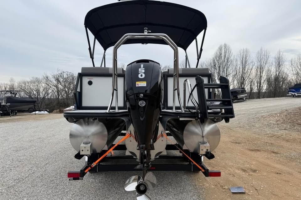 Rear view of 2026 Alara 22Q boat with 150 HP outboard motor.