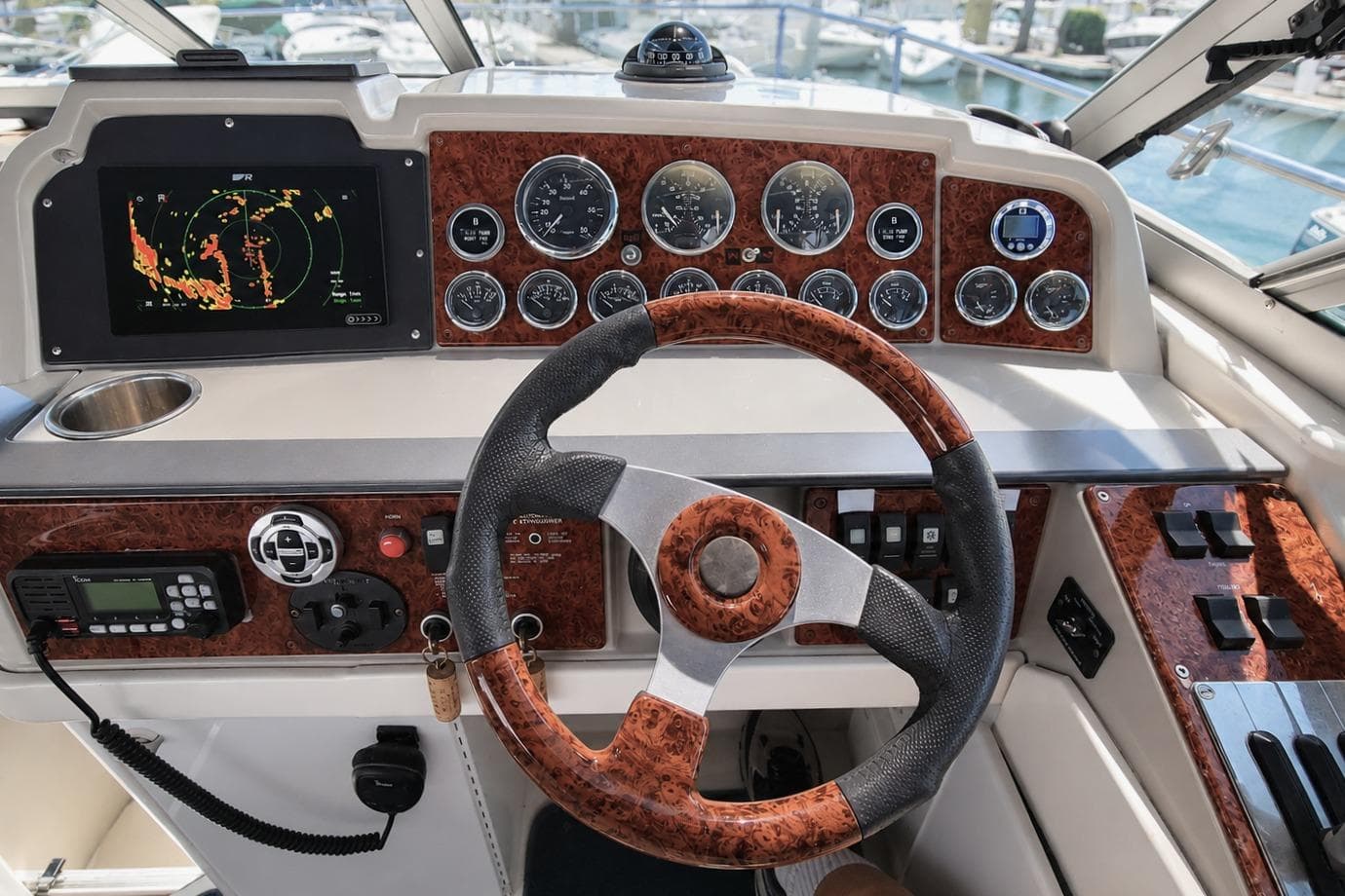2003 Formula 31 Performance Cruiser dashboard with steering wheel and navigation instruments.
