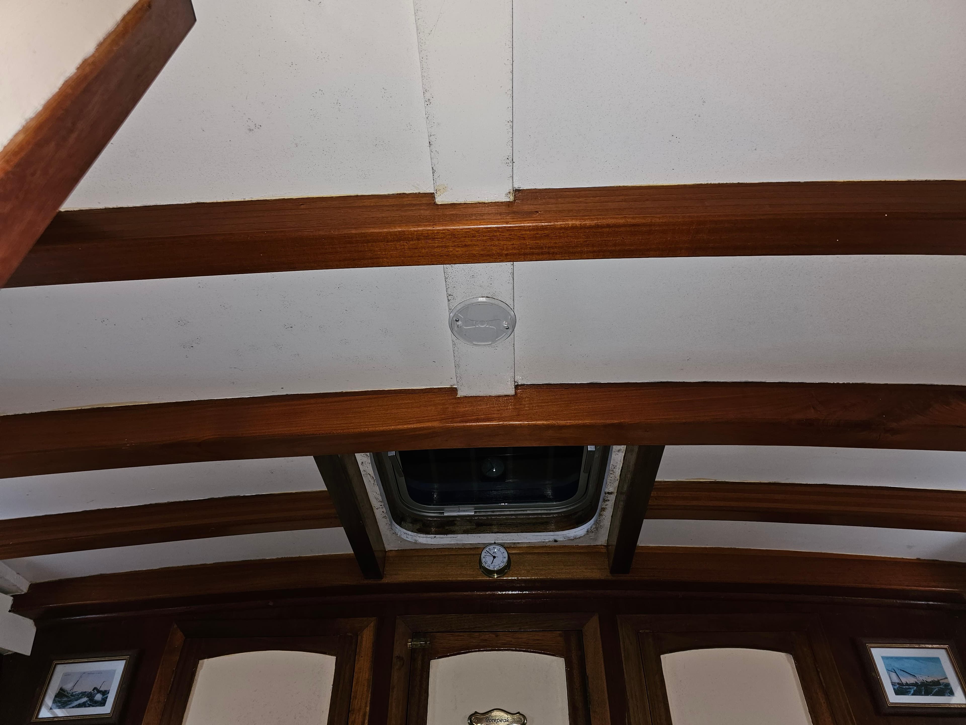 Interior ceiling of 1978 Custom John Bain TSMY with wooden beams and hatch.