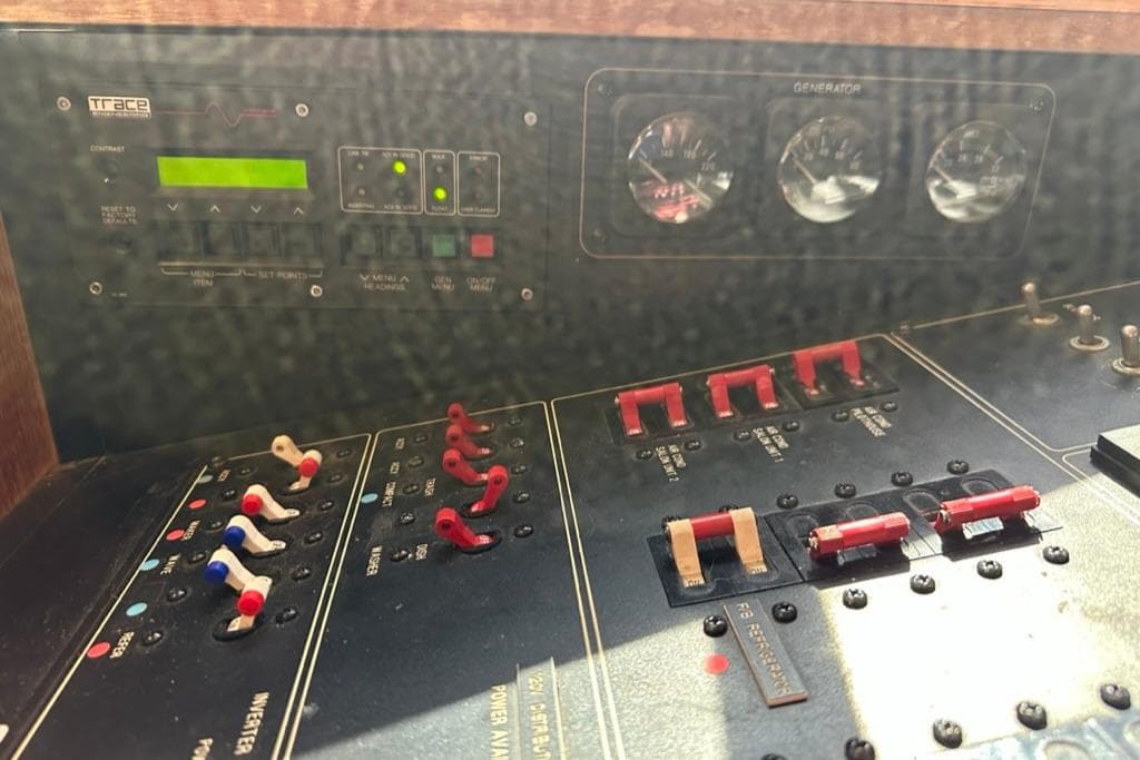 Control panel of a 1999 Bayliner 5788 Pilot House Motoryacht, featuring switches and gauges.