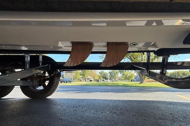 2020 Moomba Makai boat underside with trailer, showcasing fins and suspension system.