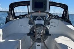 Cockpit of a 2008 Hunter 33 sailboat with steering wheel and navigation equipment.