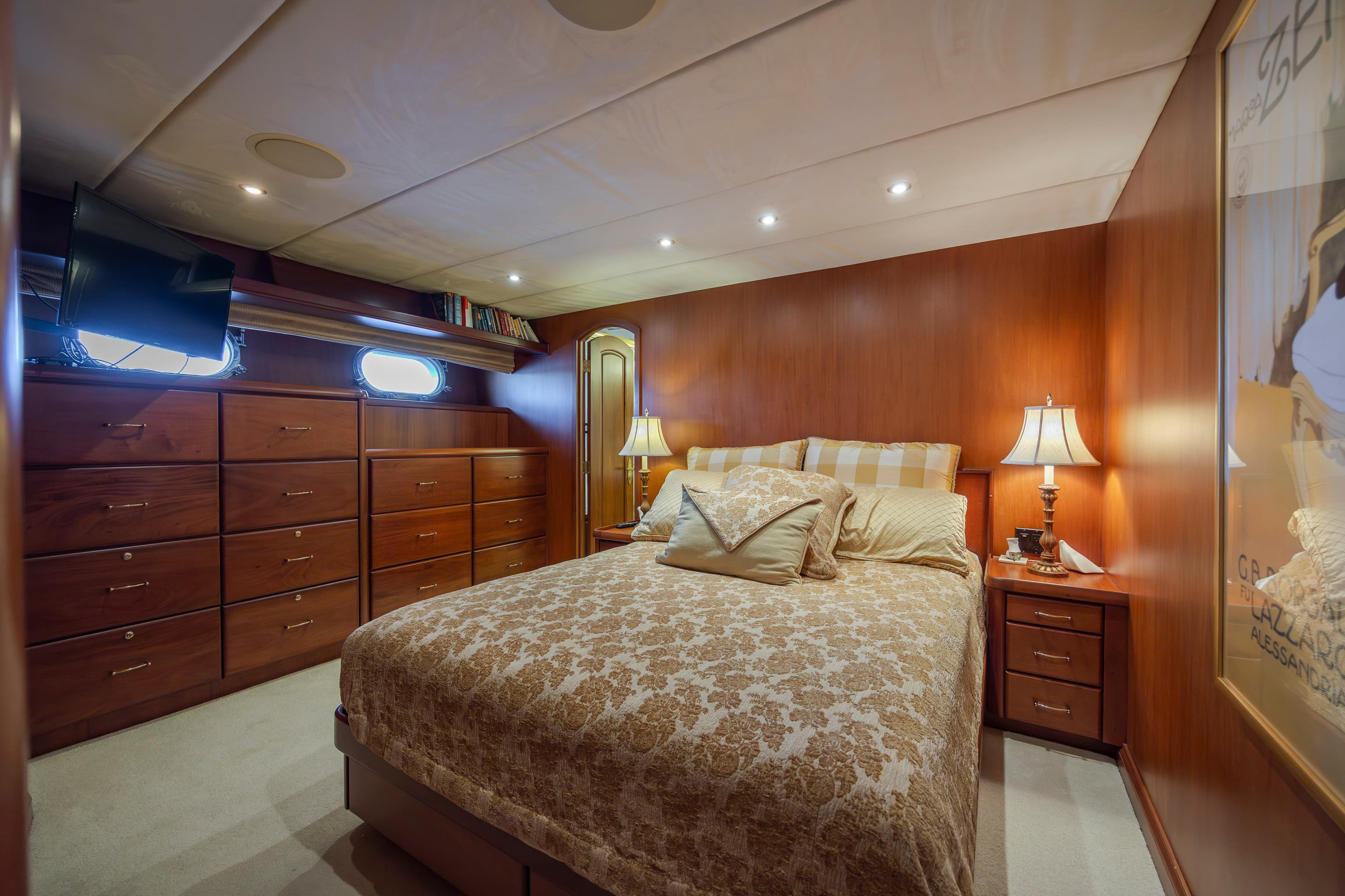 Luxurious bedroom on a 1988 Christensen Custom yacht.