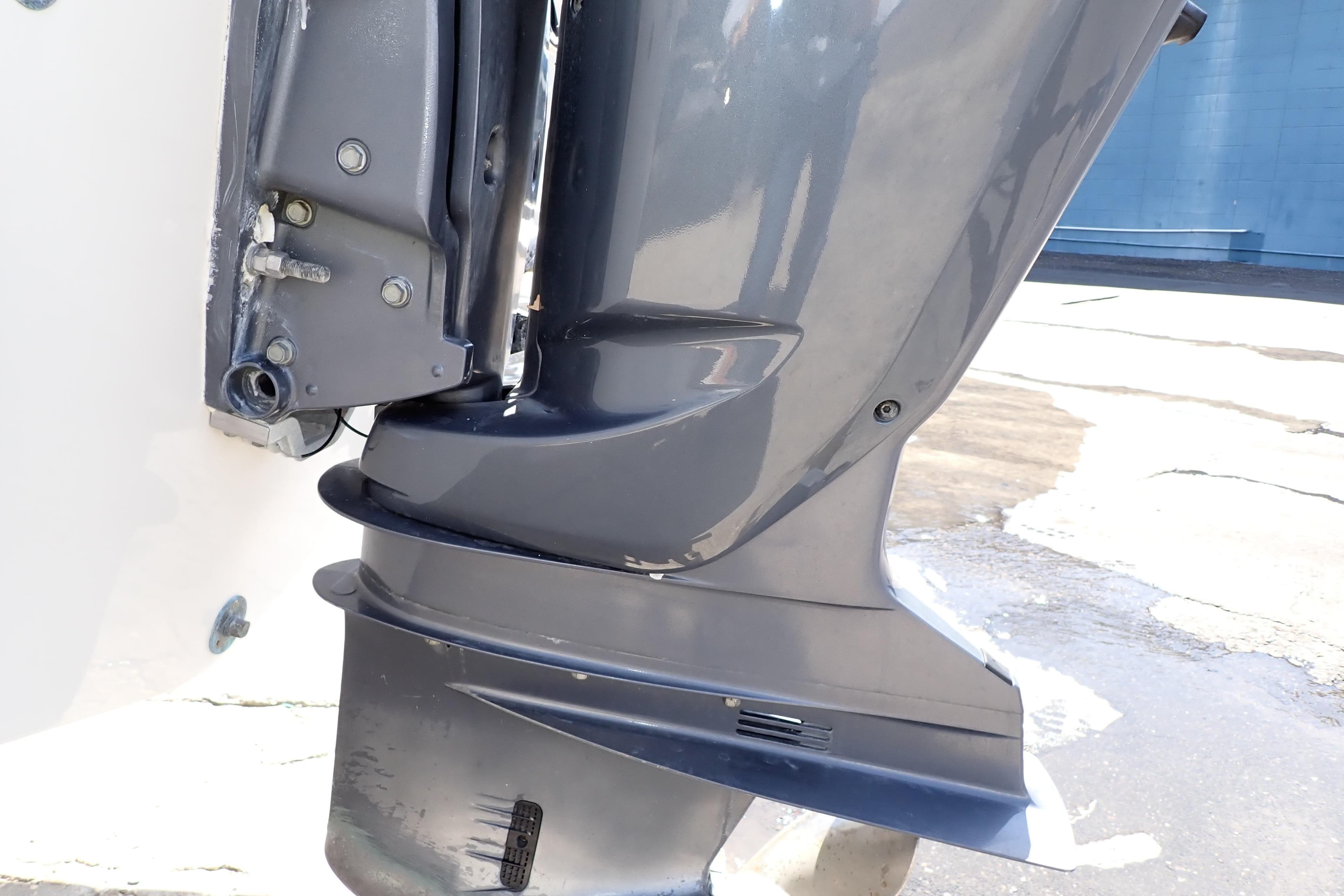 2006 Robalo R220 Center Console boat engine close-up, showcasing sleek design and metallic finish.
