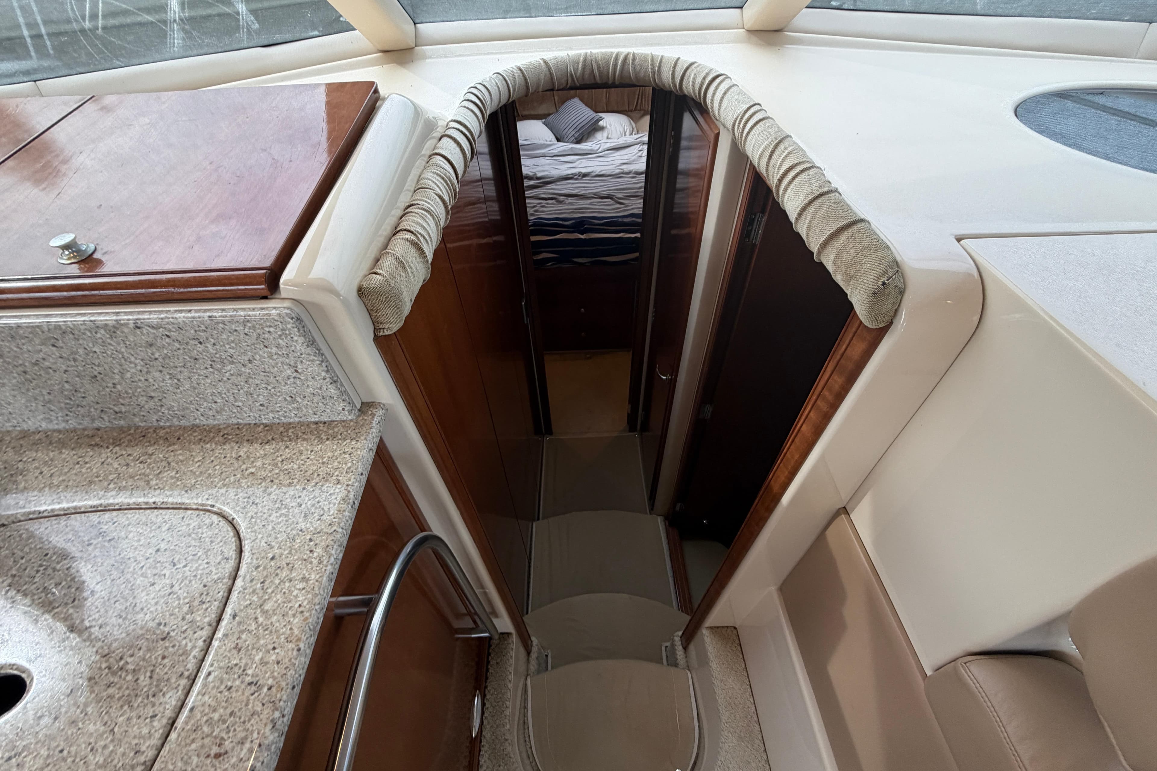 Interior view of a 2006 Meridian 411 Sedan yacht, featuring a cozy cabin entrance.