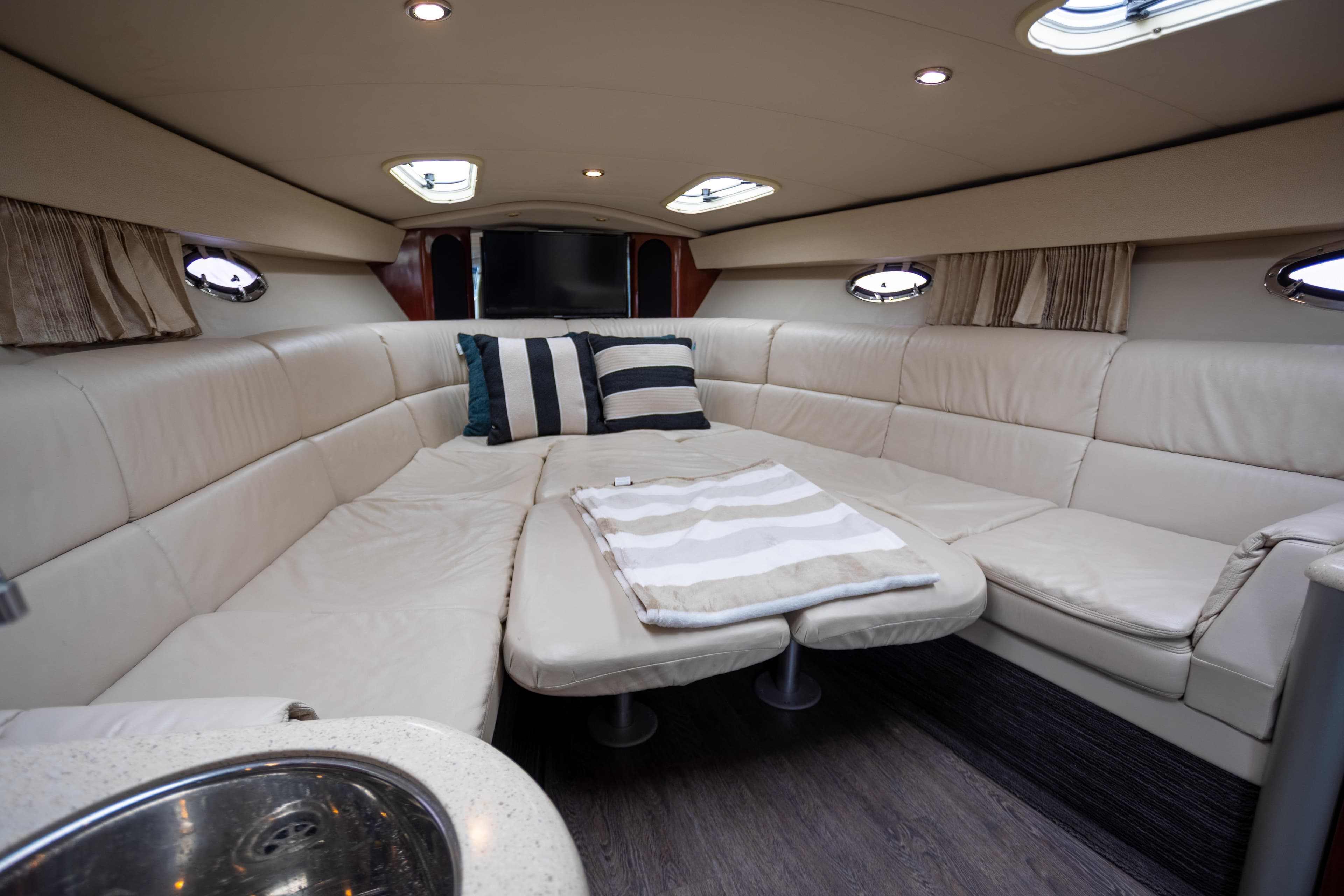 Luxurious interior of a 2005 Formula 400 Super Sport yacht with plush seating and modern design.