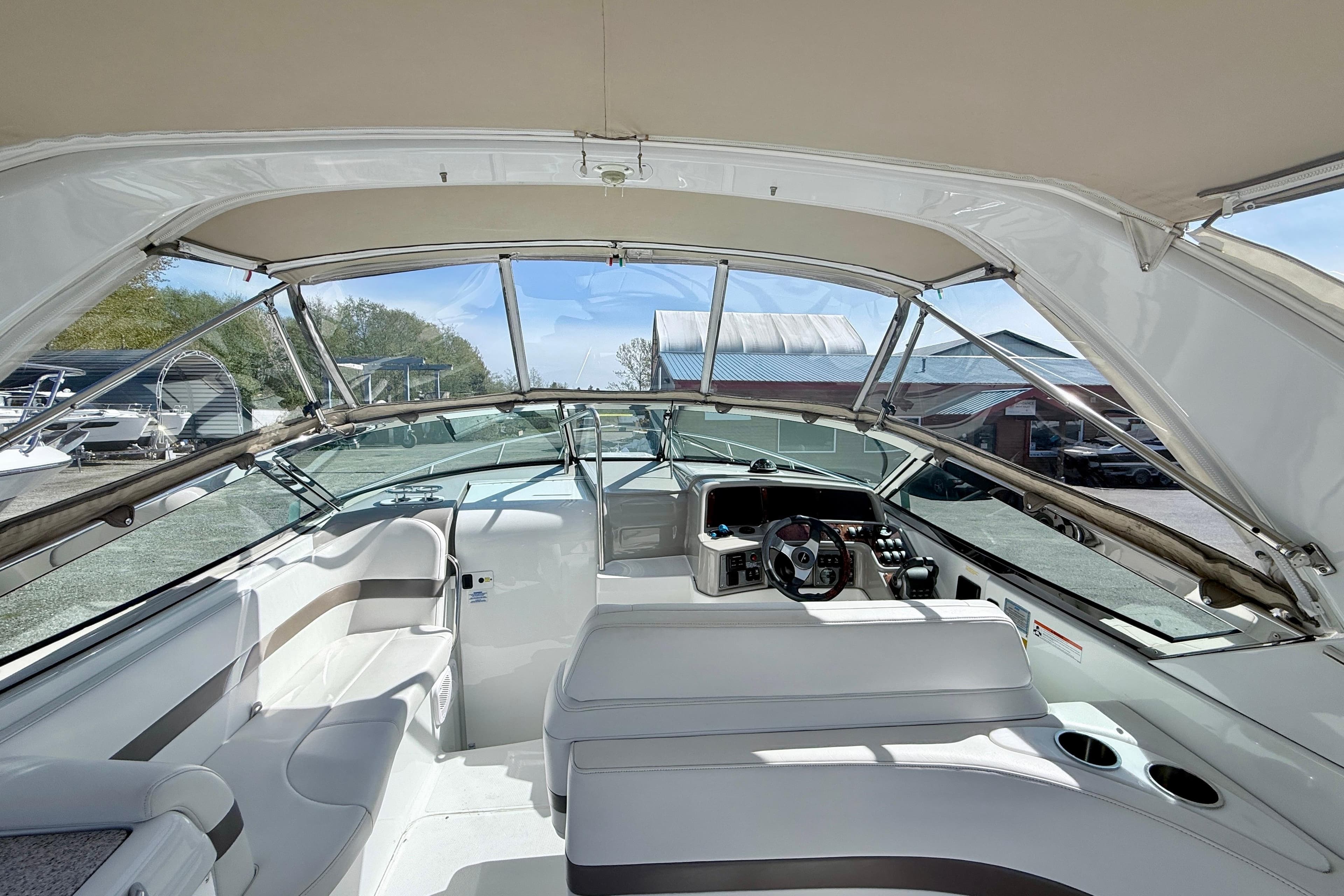Interior view of a 2004 Formula 280 Sun Sport boat with seating and helm.
