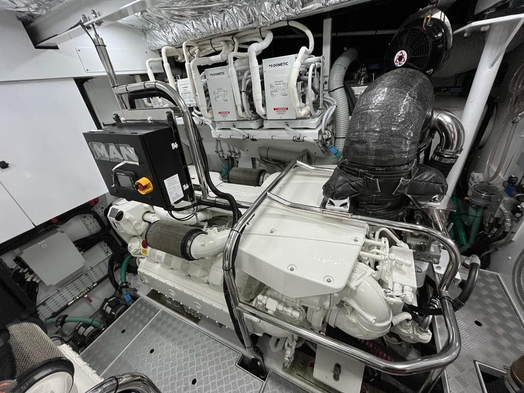 Engine room of a 2021 Princess Y72 yacht, featuring MAN engines and advanced equipment.