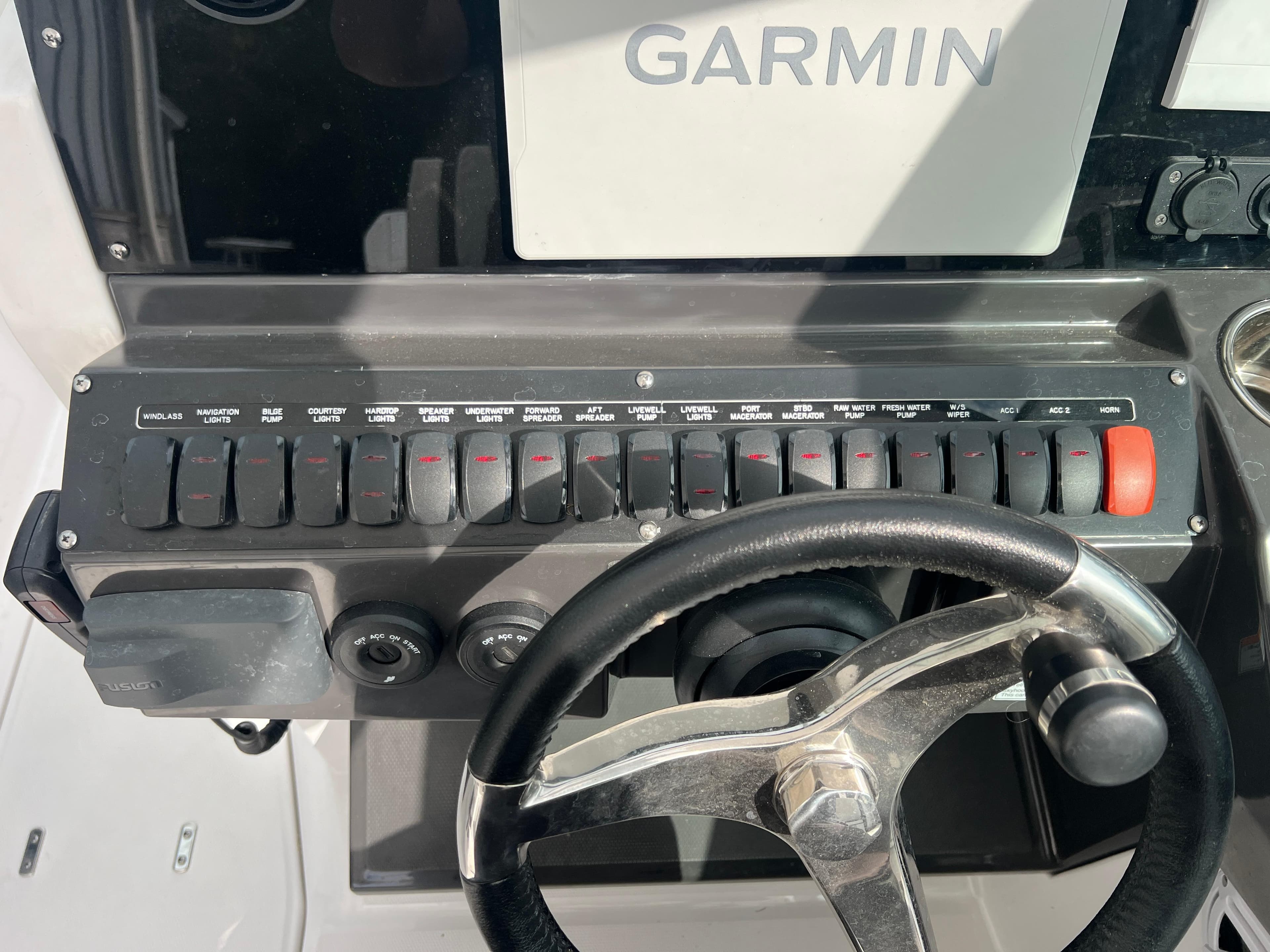 2024 Blackfin 272 DC dashboard with Garmin display and steering wheel.