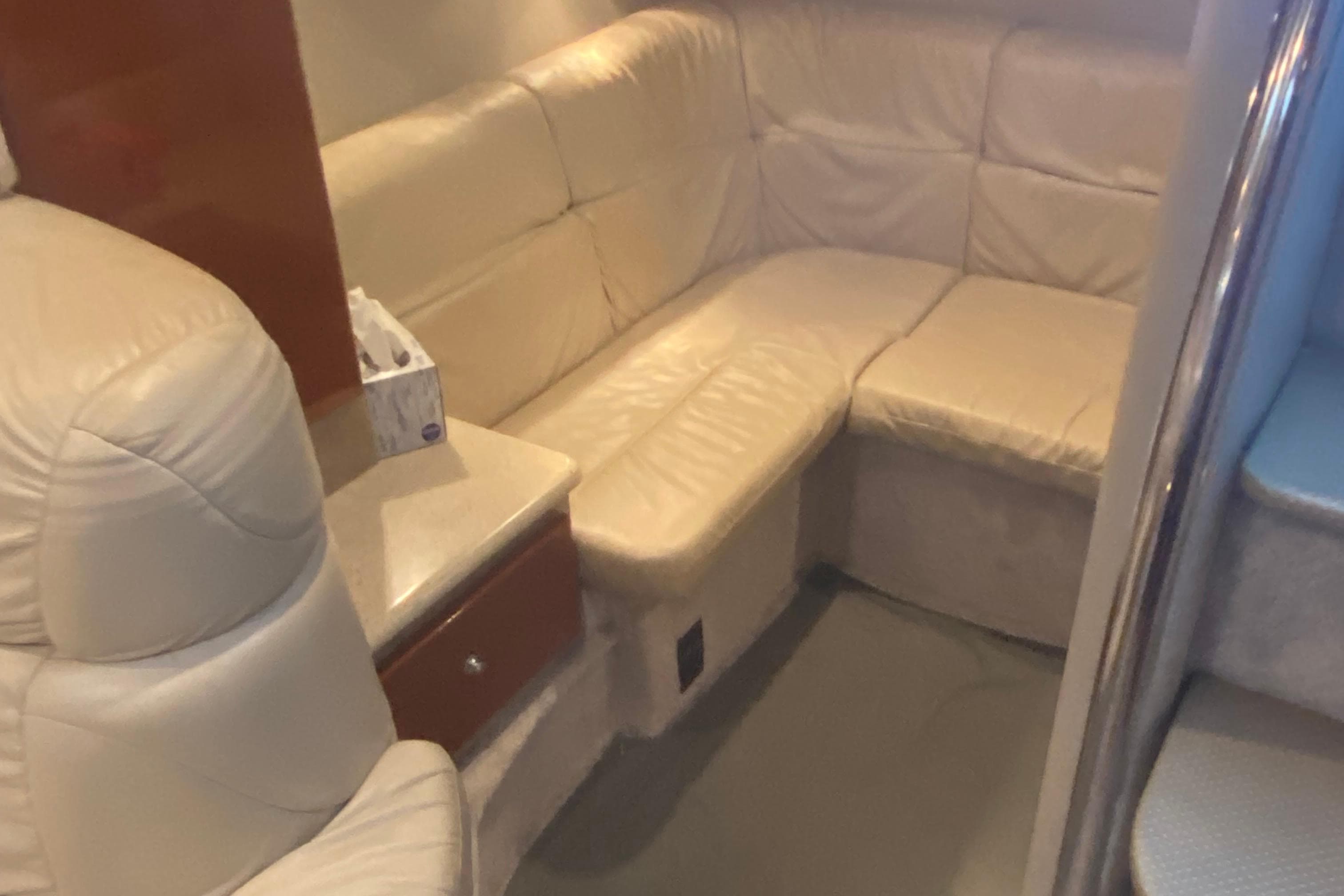 Luxurious beige leather seating in a 2005 Formula boat interior.