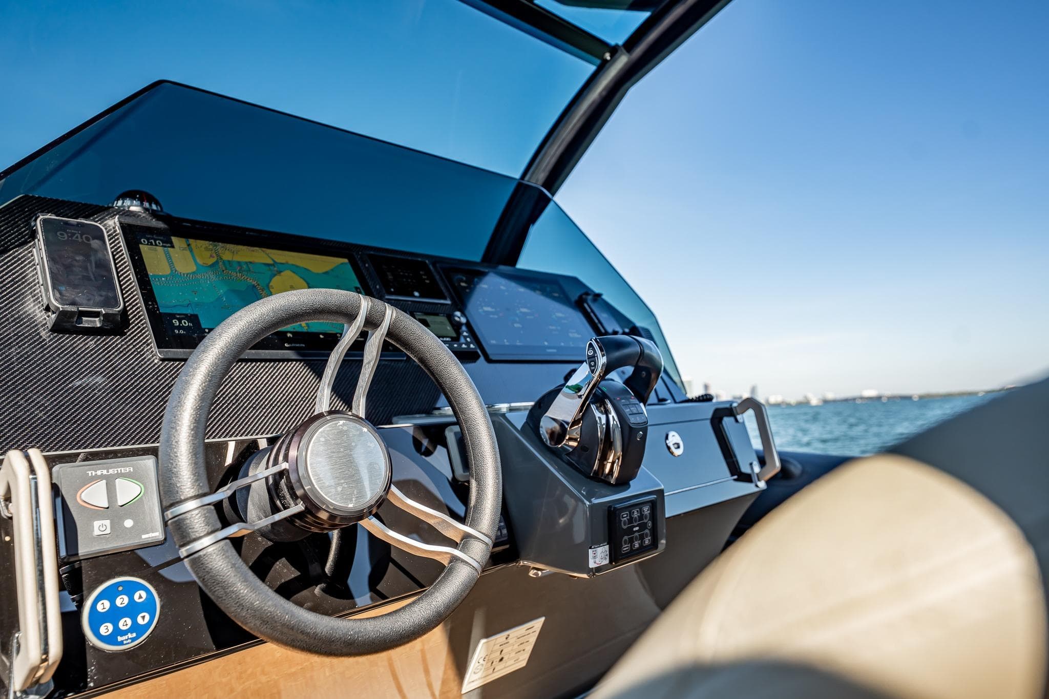 Helm of 2023 Skipper-BSK 38NC boat with navigation controls and sea view.