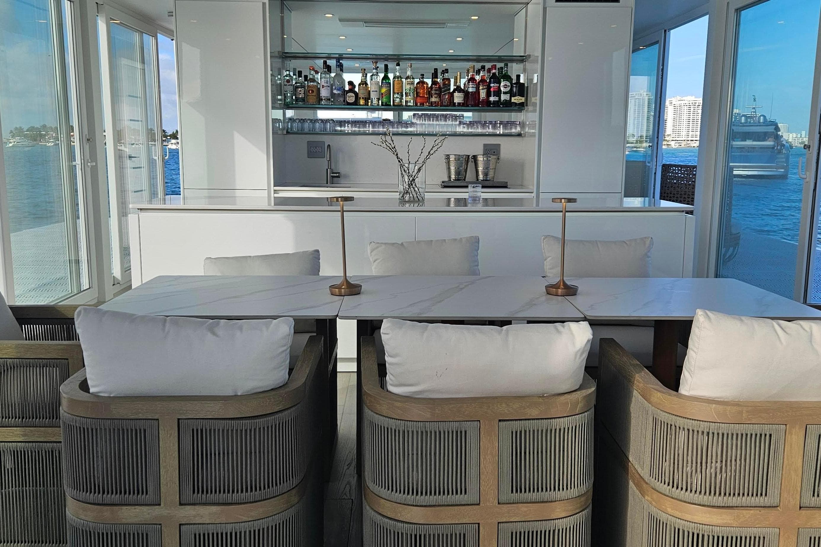 Luxurious ARKHAUS Villa 50 interior with elegant bar and waterfront view, 2025 model.