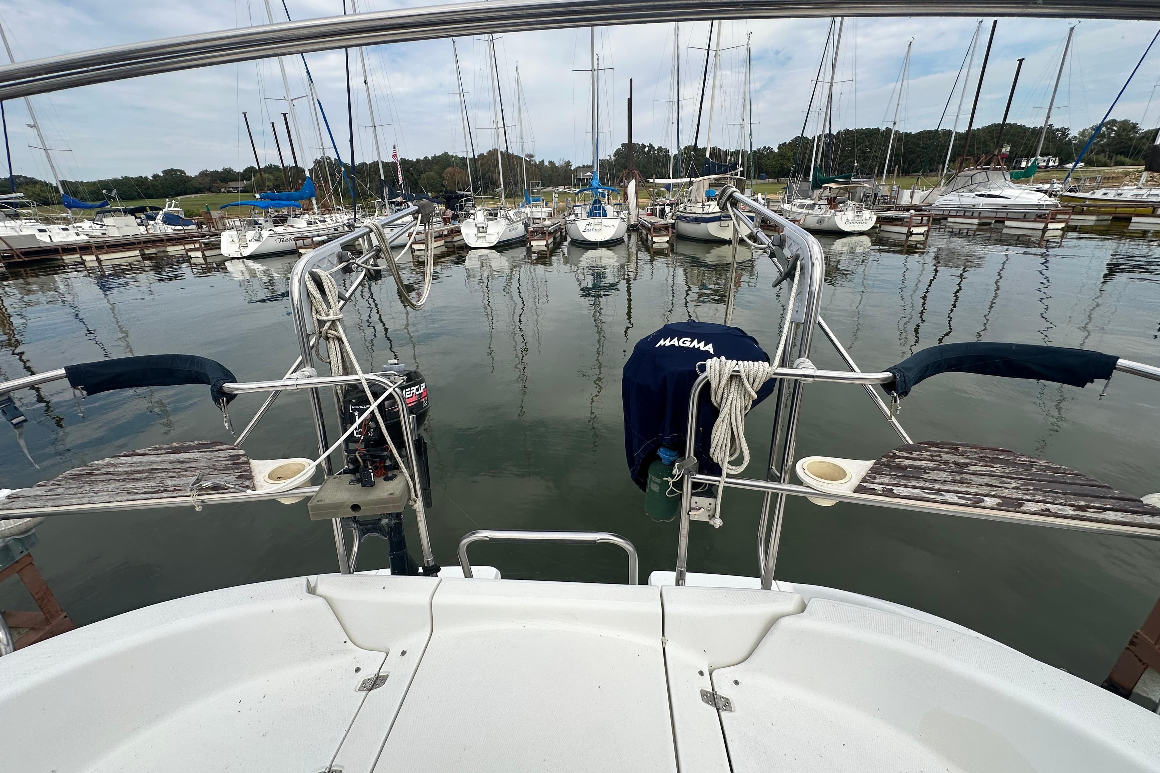 Hunter 376 sailboat from 1997 docked at a marina with other boats.