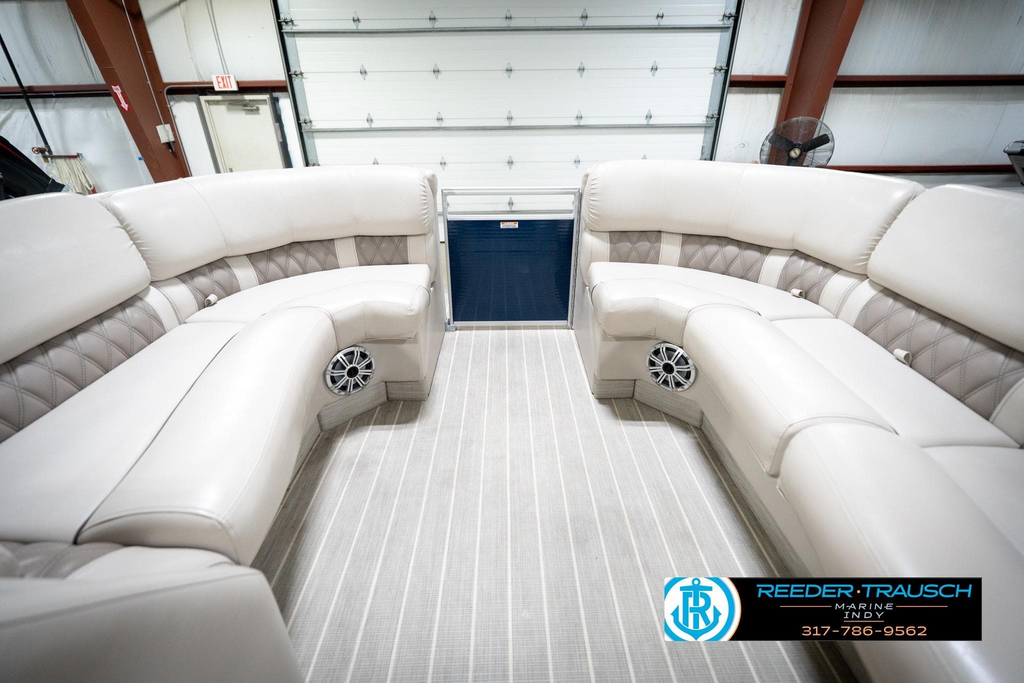 Luxurious interior of 2016 Bennington 2375 RSB pontoon boat with plush seating.