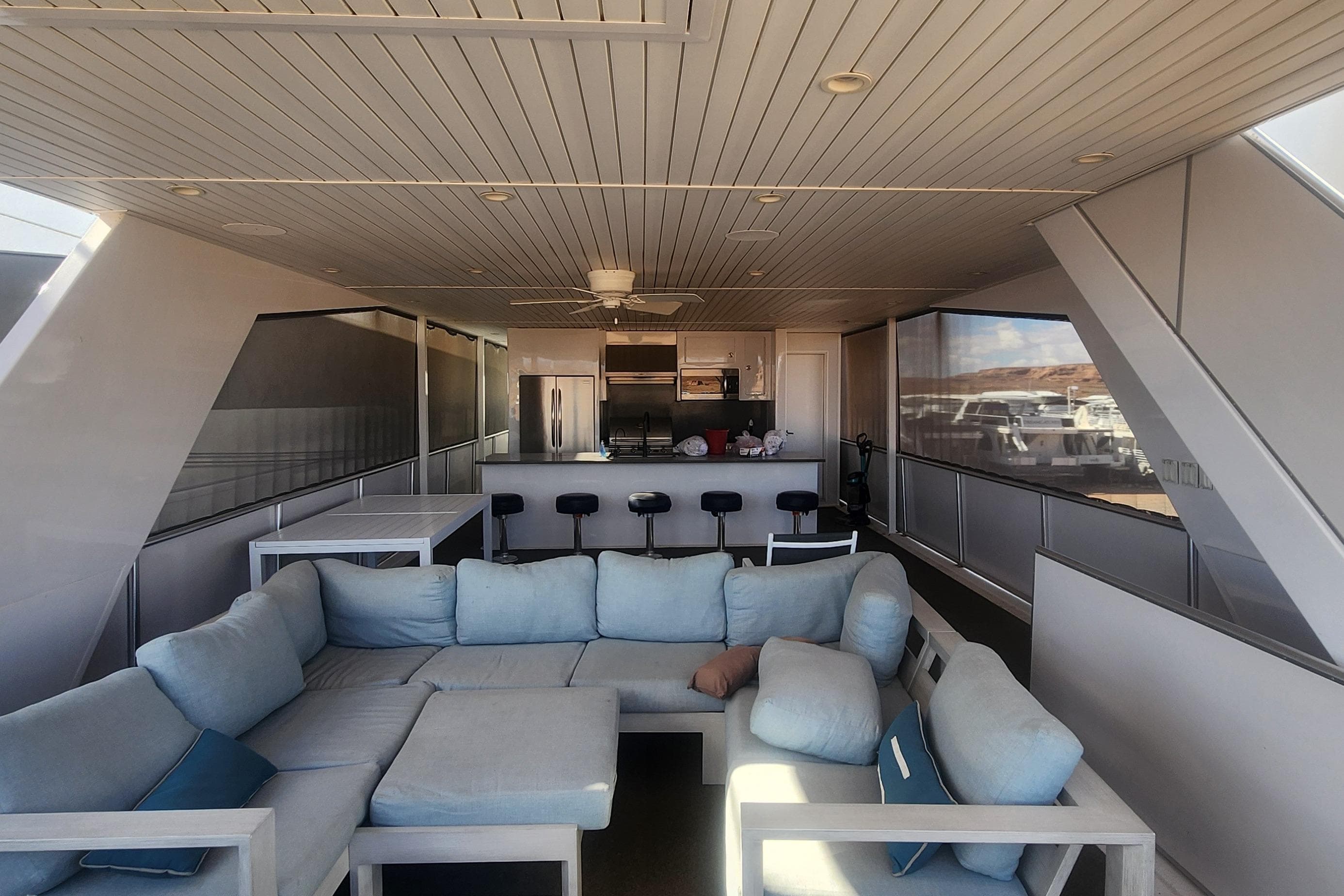 Luxurious interior of 2022 Adonia Legacy Share #8 yacht with modern kitchen and seating area.