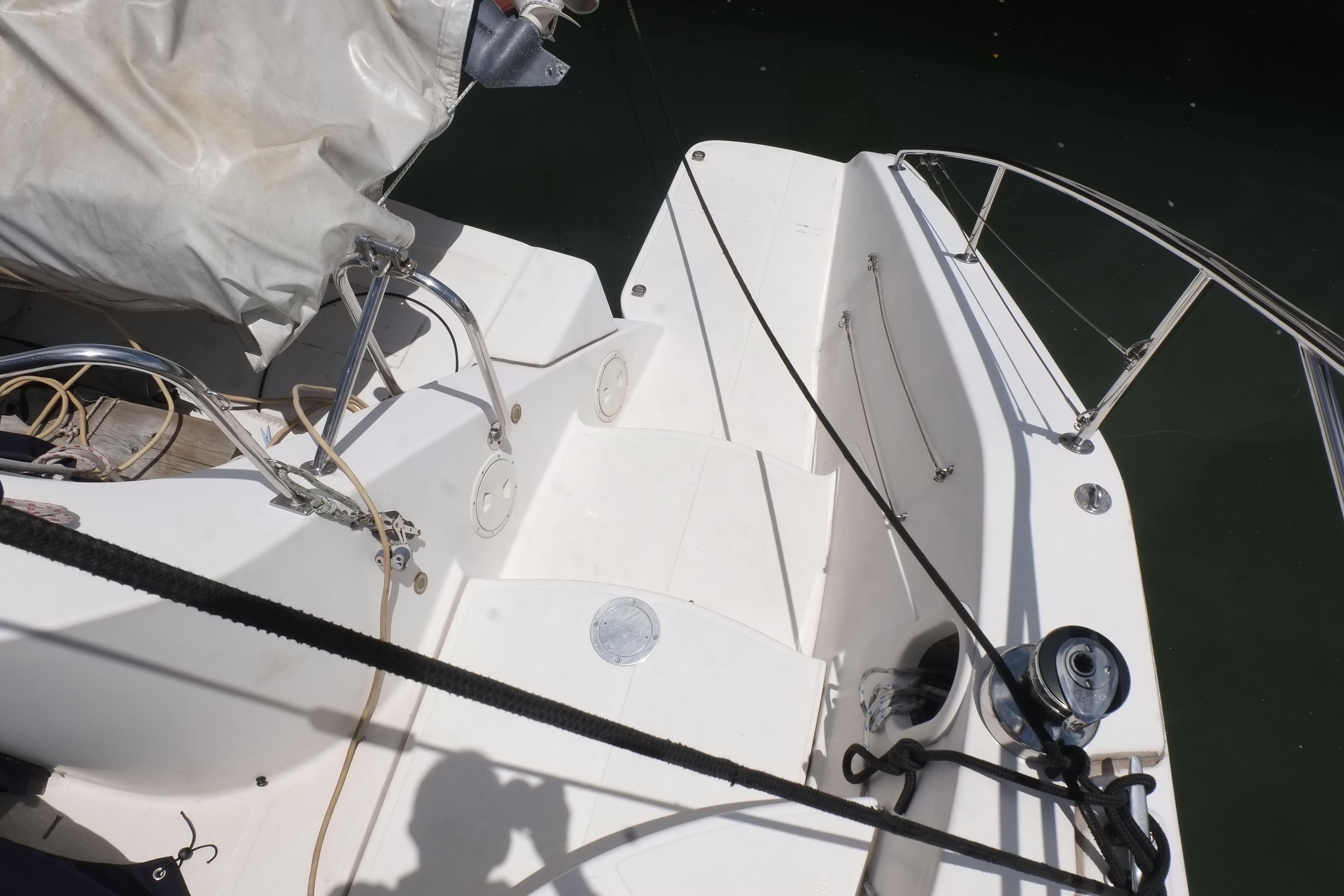 Sailboat deck of 2007 Lightwave 38, featuring ropes and winch.