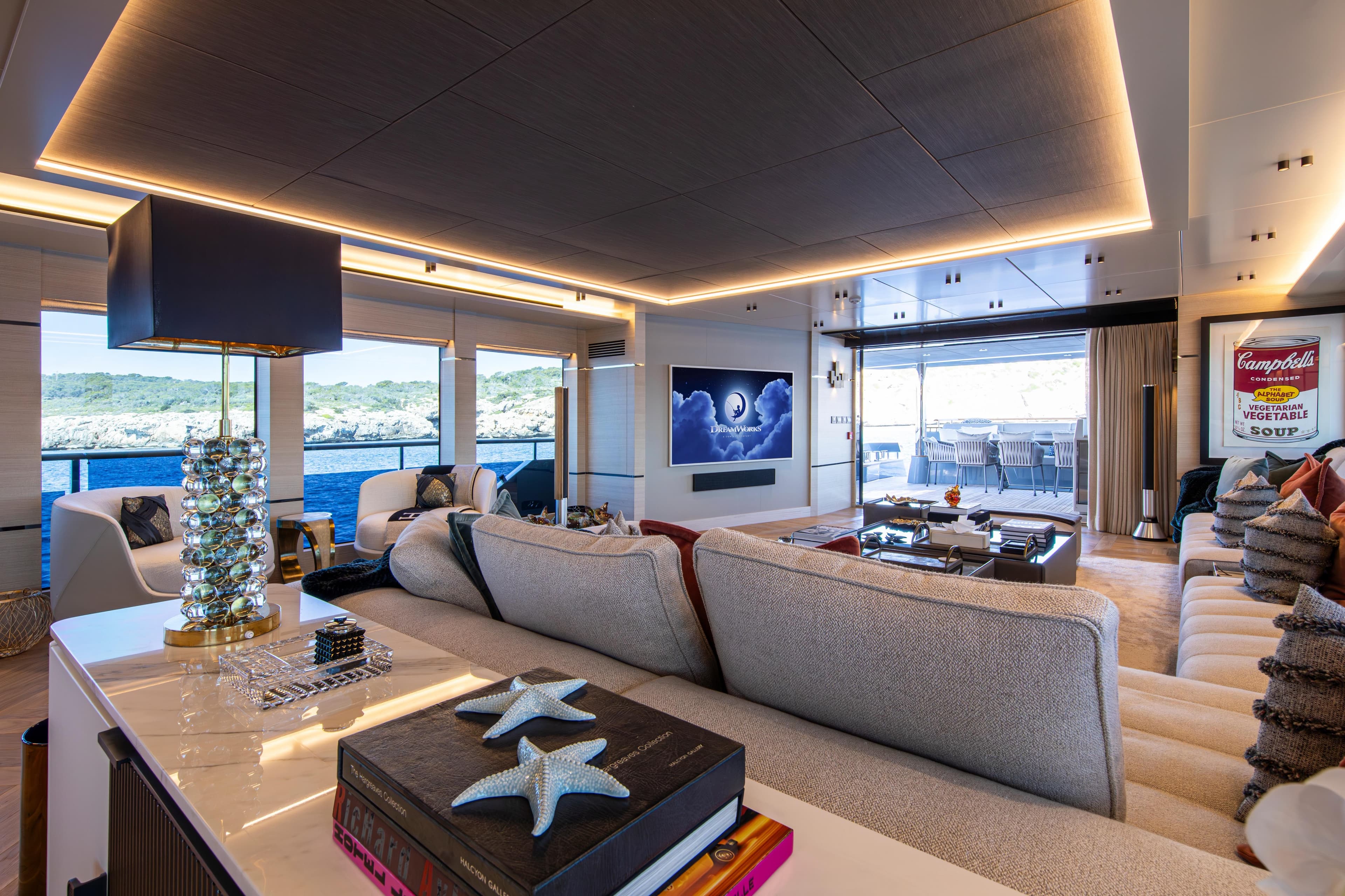 Luxurious interior of 2023 Numarine 37XP yacht with modern decor and ocean view.
