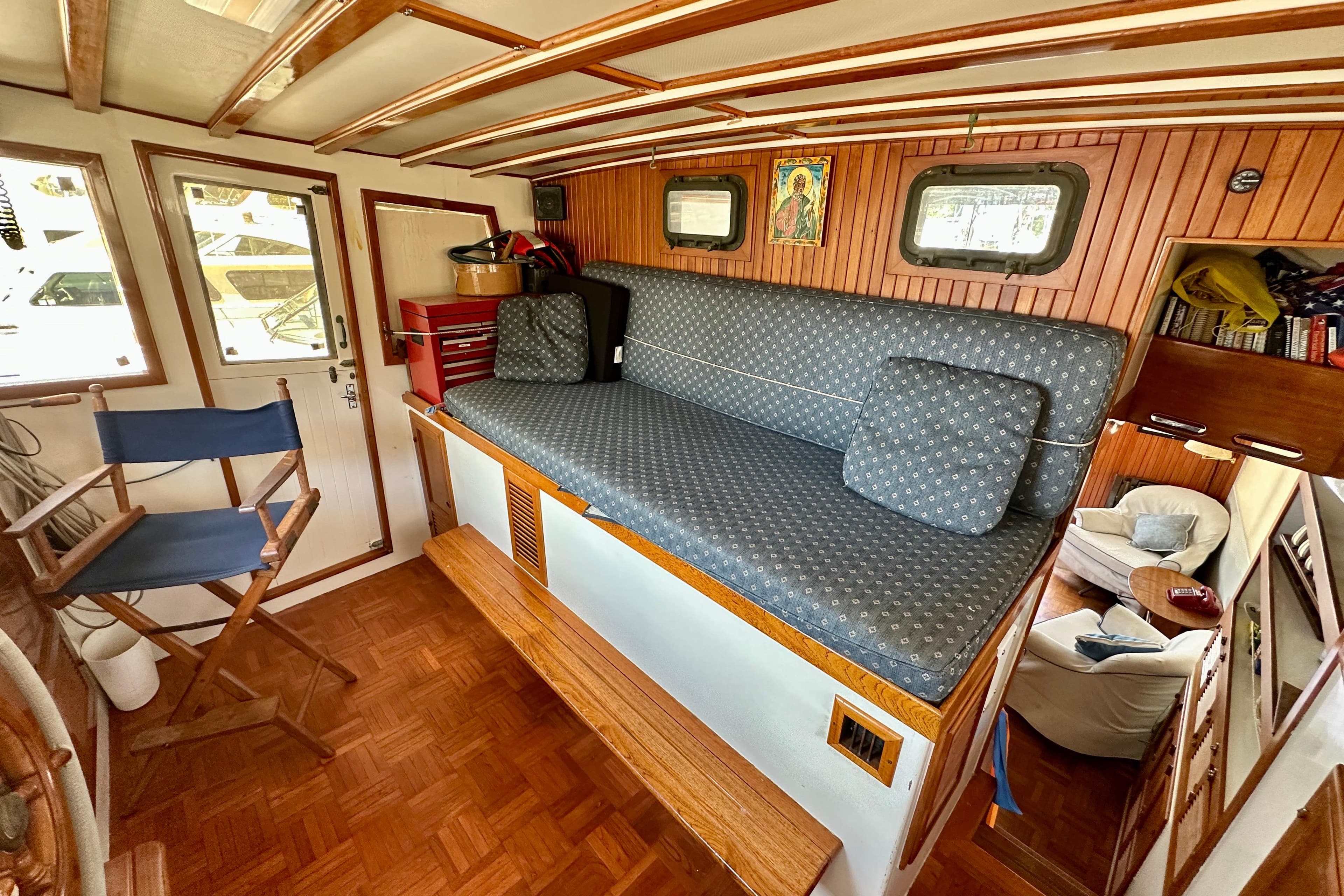 1983 Kadey-Krogen Krogen 42 Trawler interior with cozy seating and wooden accents.