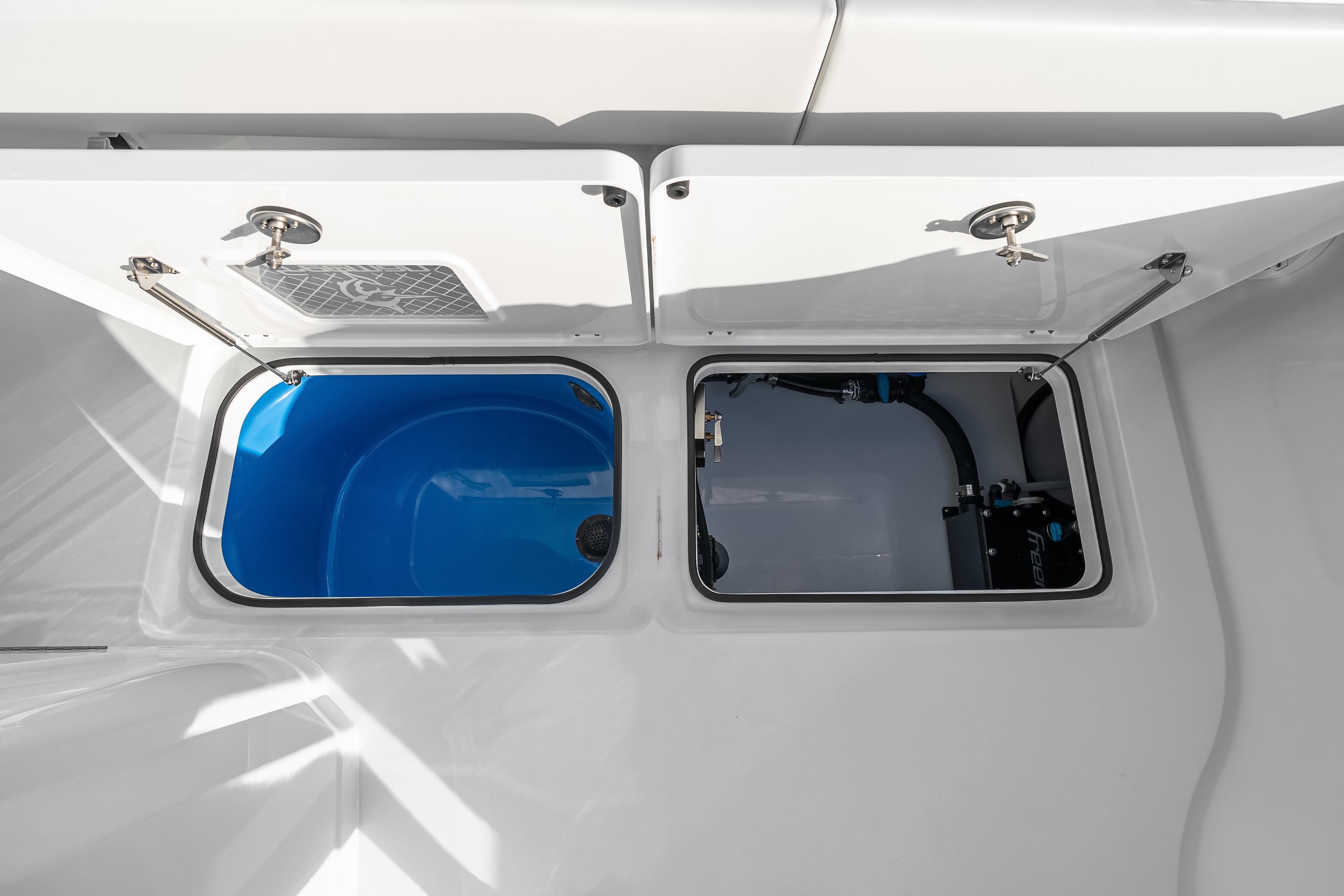 Freeman 38 (2026) boat storage compartments with open hatches, showcasing interior details.