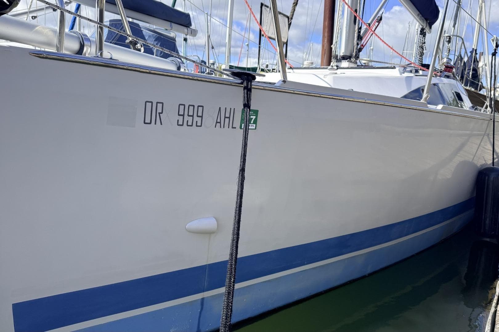 2016 Catalina 275 Sport sailboat docked in harbor.