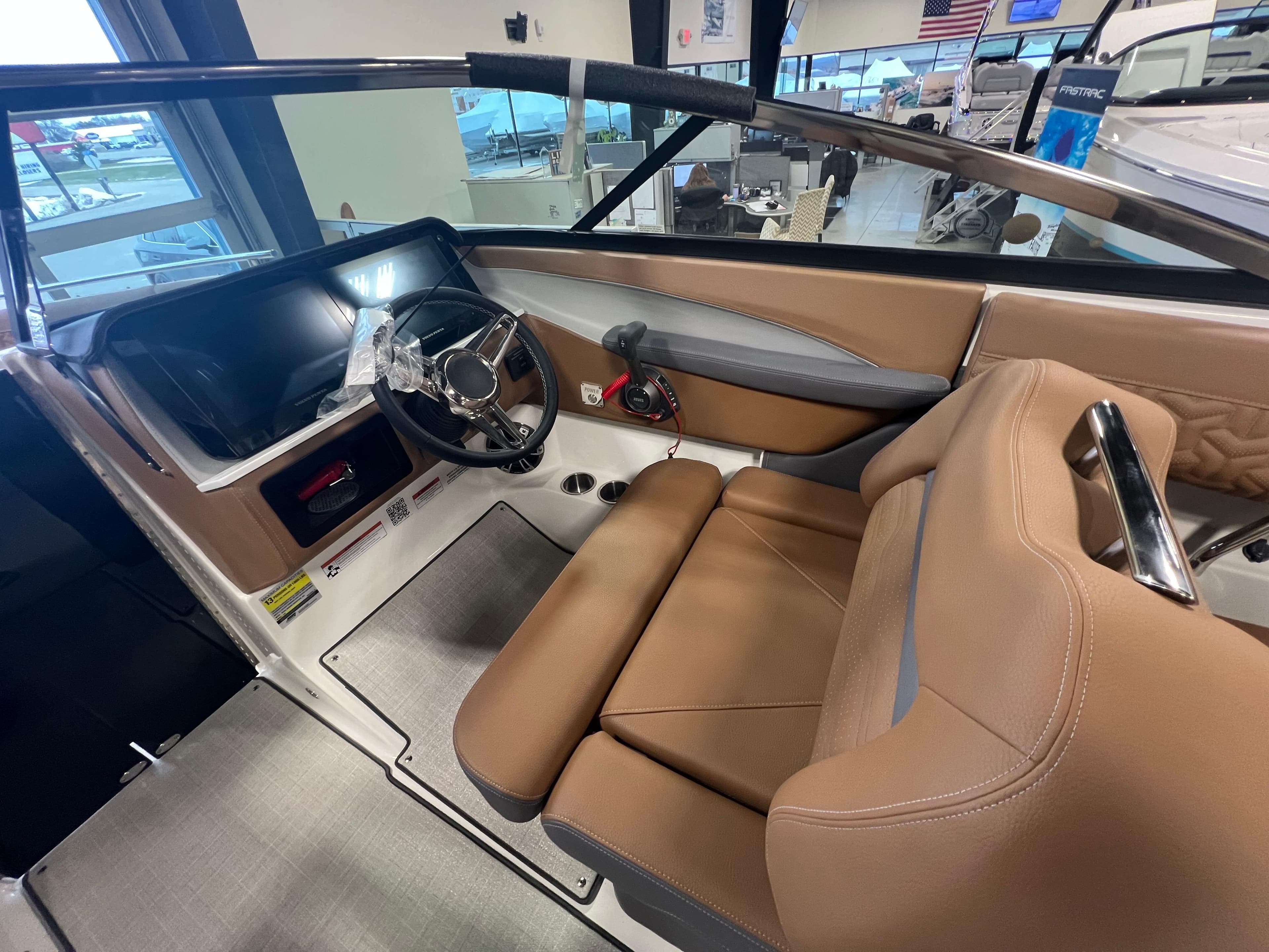 2025 Regal LS4 boat interior with tan seating and modern dashboard.