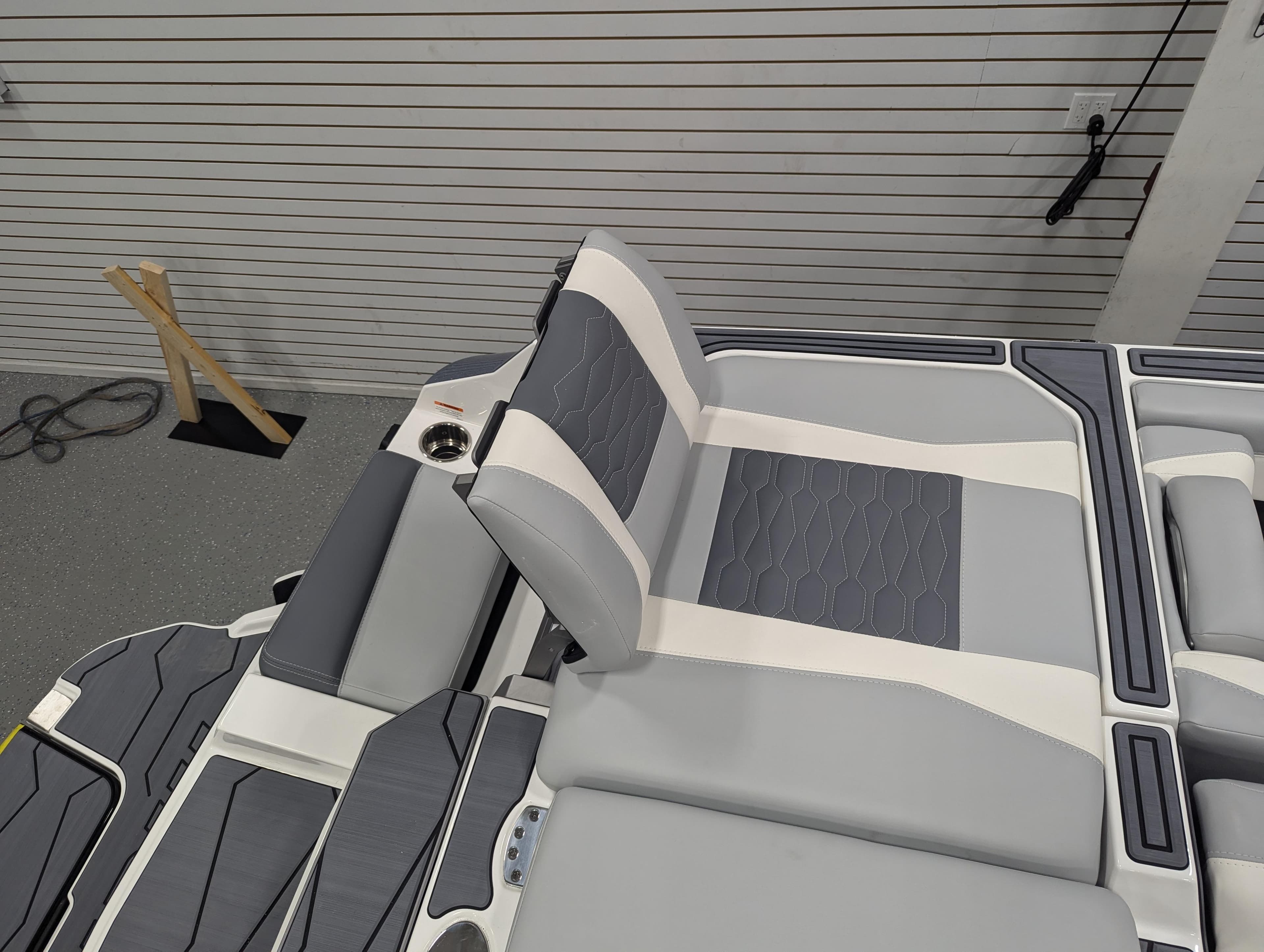 2025 Malibu Wakesetter 24 MXZ interior seating with gray and white upholstery.